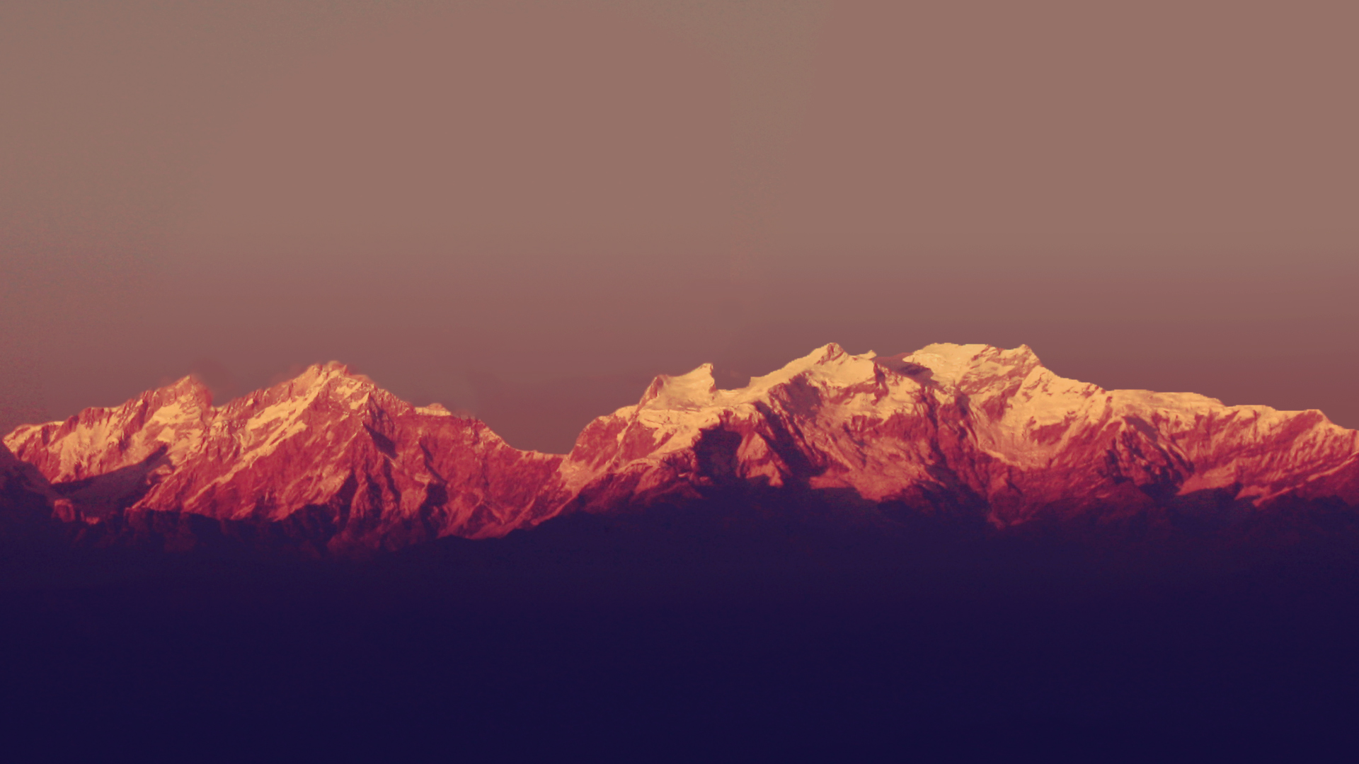 Snow-capped mountains at sunset HD Wallpaper