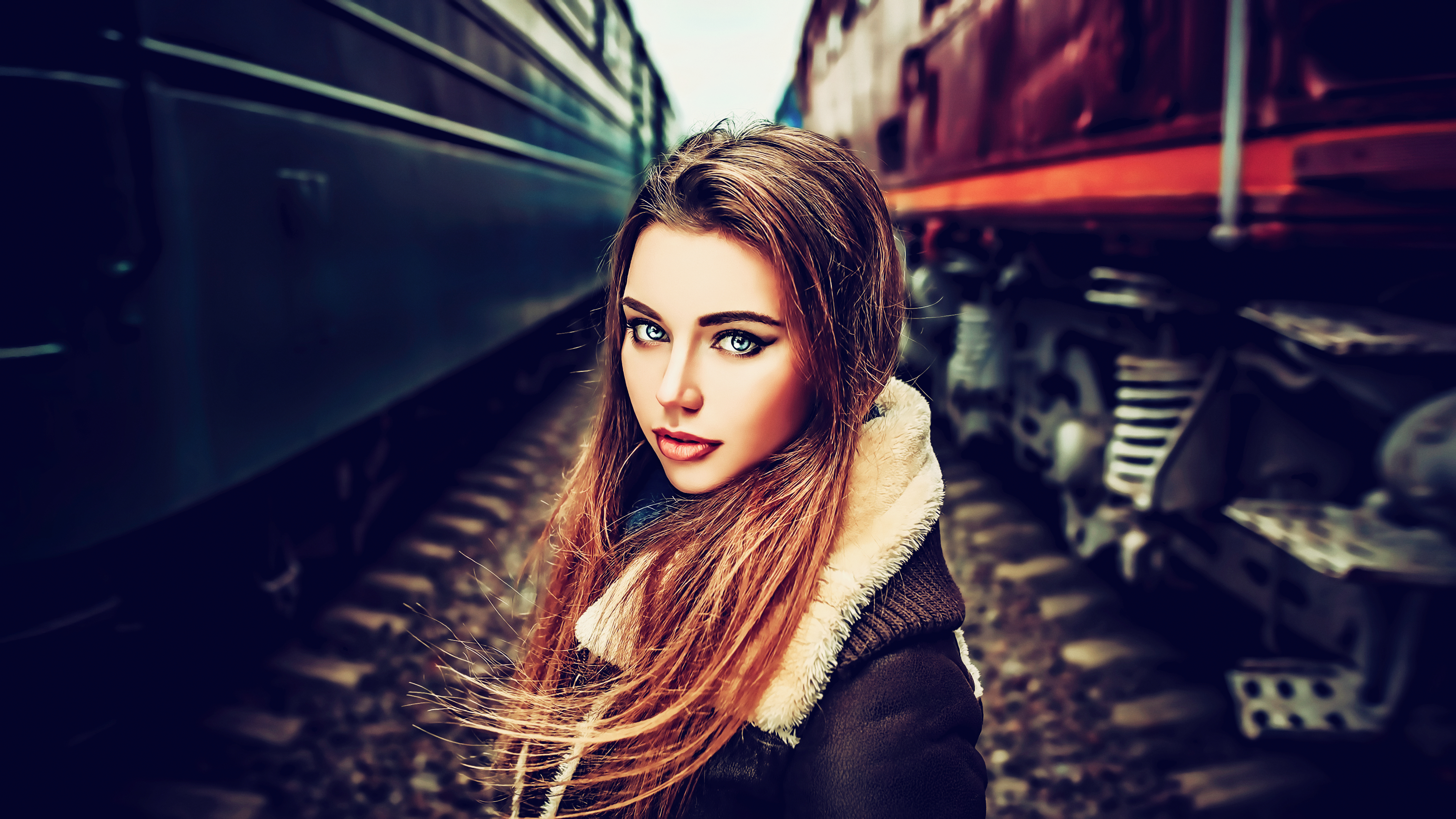 Woman with long hair standing between trains HD Wallpaper