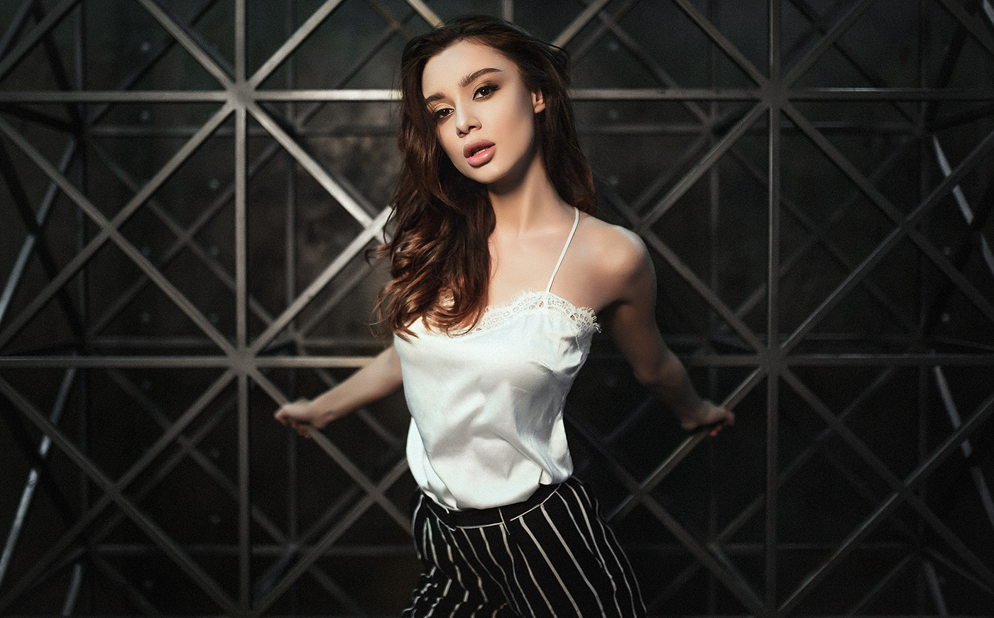 Tanned woman in white top and striped pants HD Wallpaper