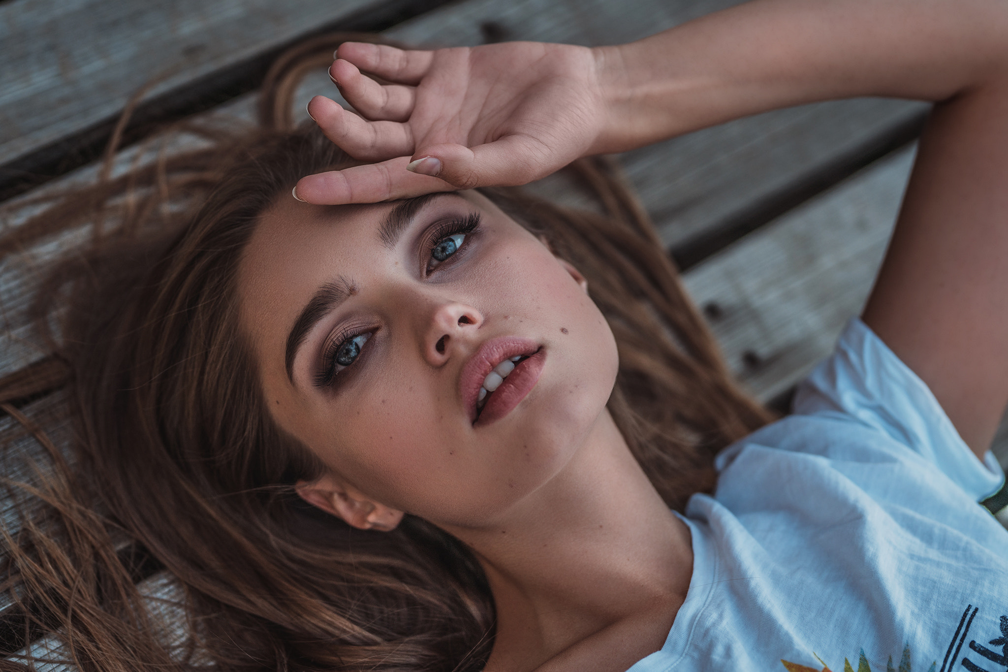 Woman lying on wooden planks HD Wallpaper