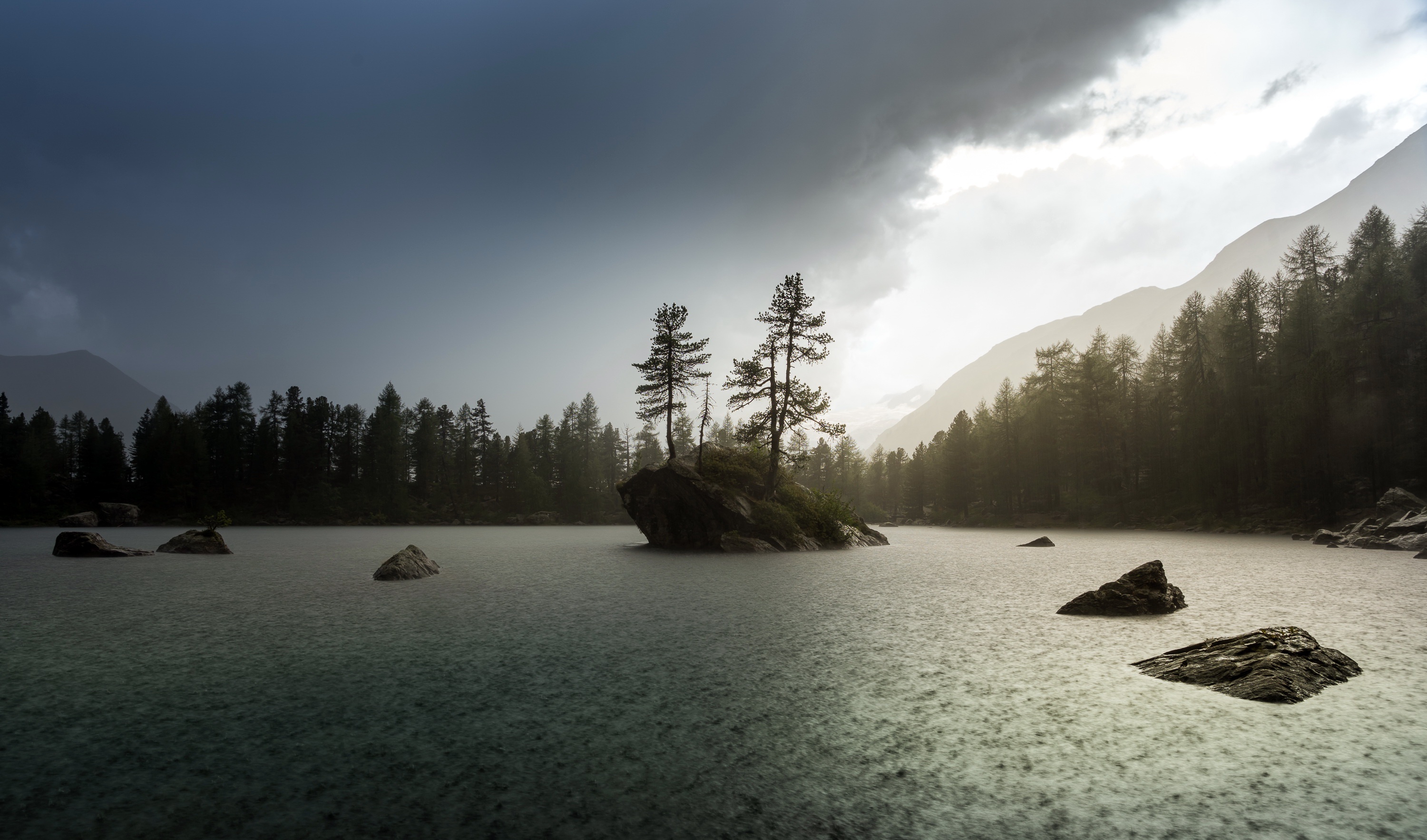 Rainy lake with trees and mountains HD Wallpaper