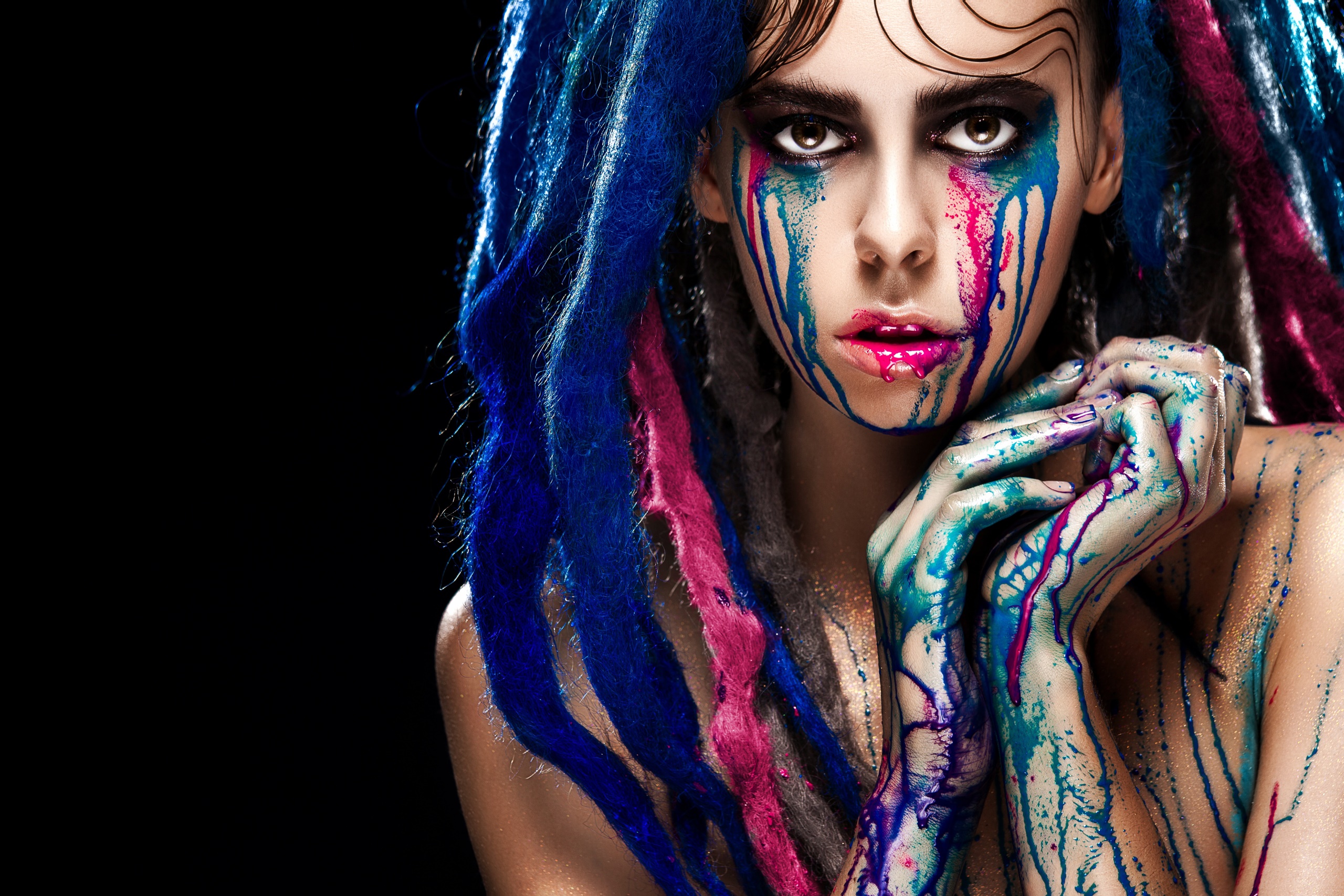 Woman with colorful paint and blue dreadlocks HD Wallpaper