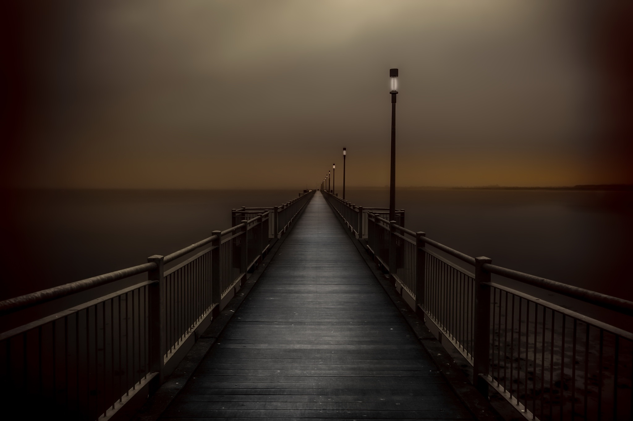Pier with lanterns over the sea at dusk HD Wallpaper