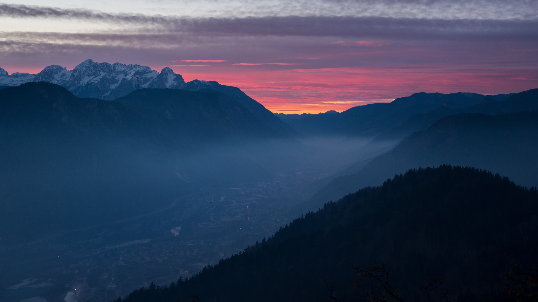 Misty valley at dawn with snow-capped mountains HD Wallpaper