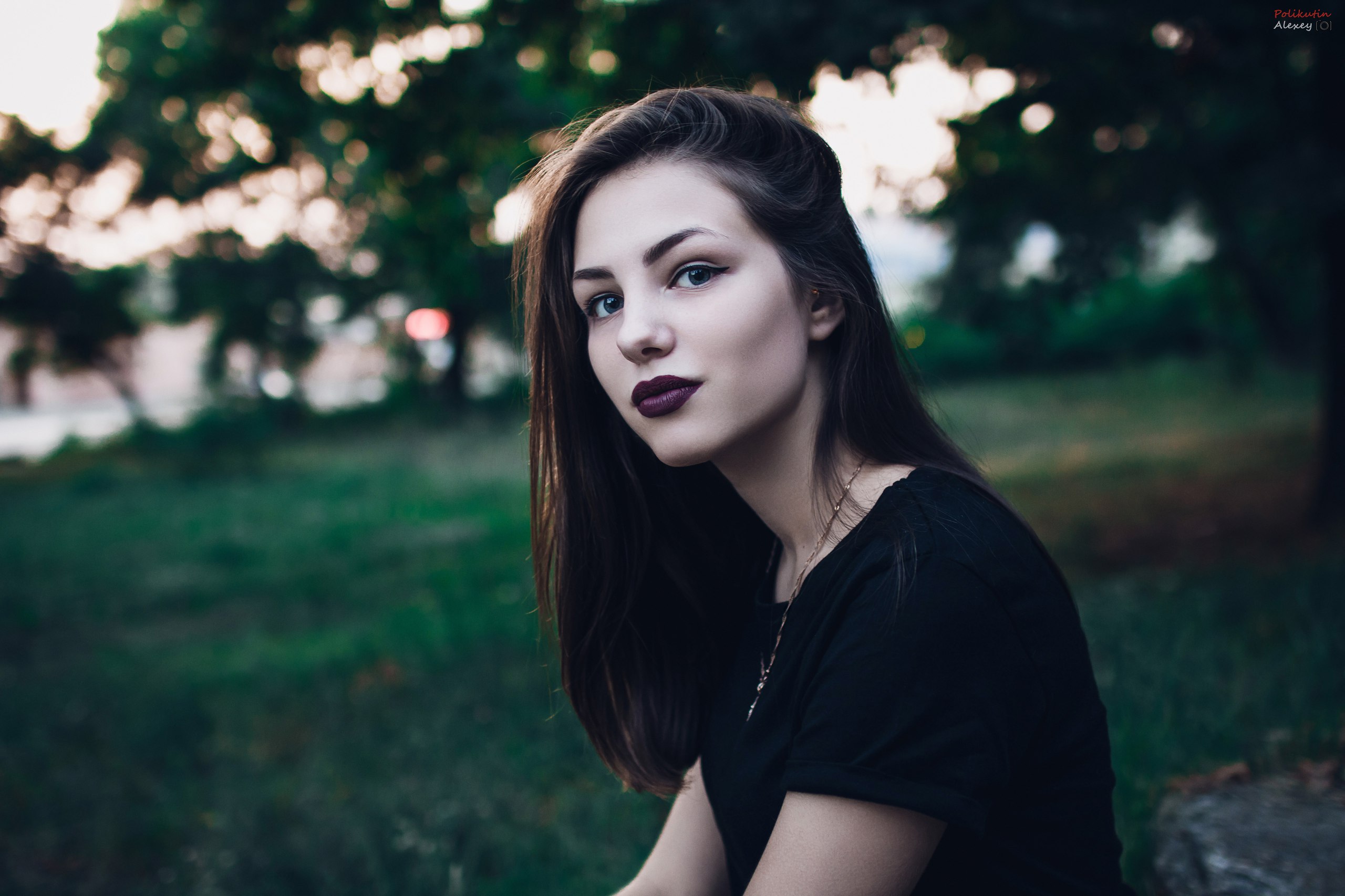 Woman in black t-shirt with dark lipstick outdoors HD Wallpaper