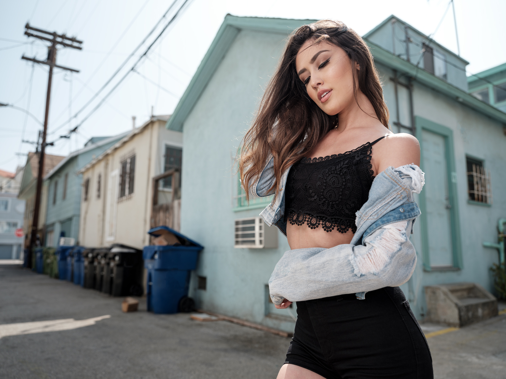 Woman in black crop top and denim jacket in alley HD Wallpaper