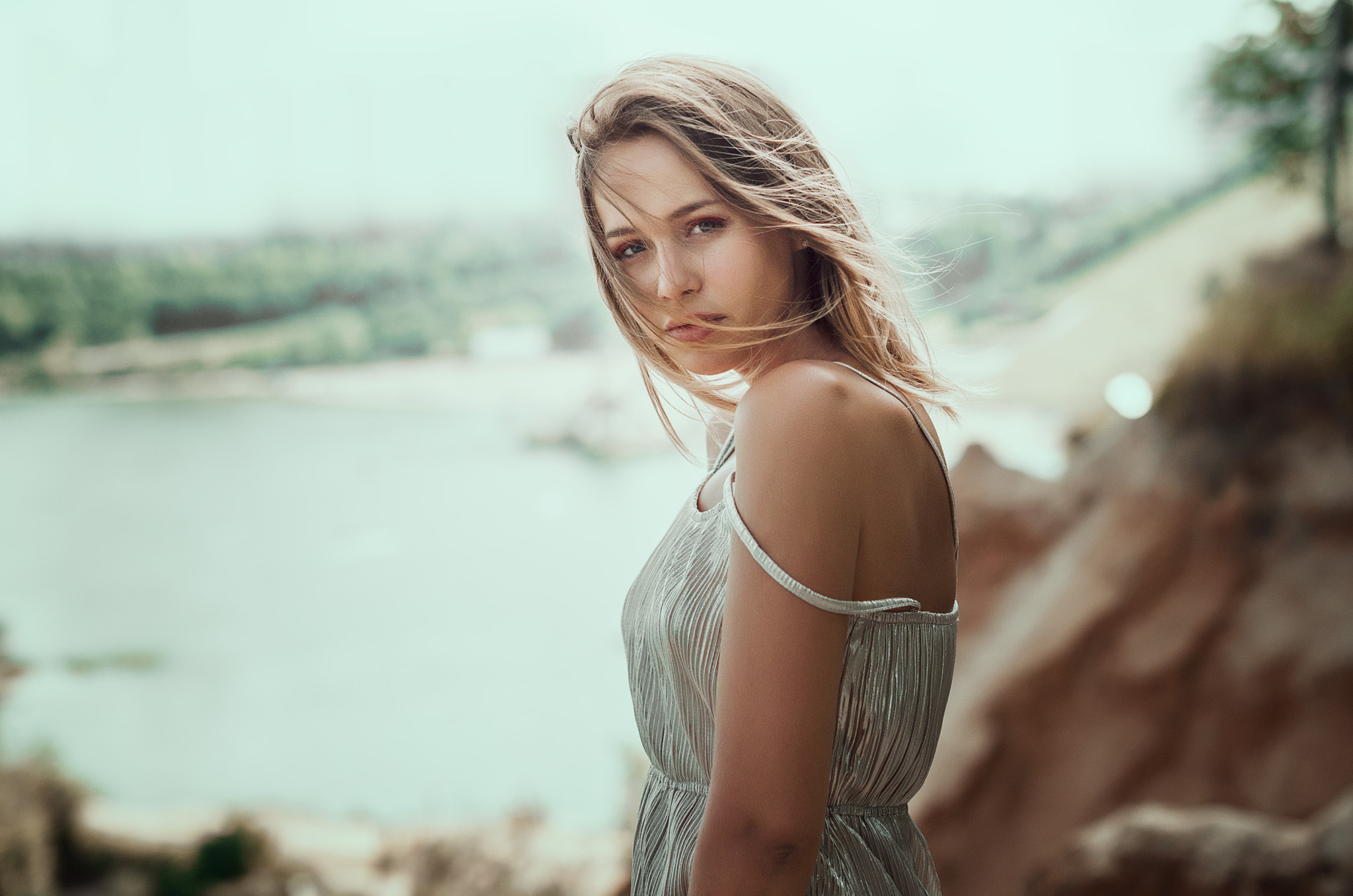 Woman in a silver dress by a lake HD Wallpaper