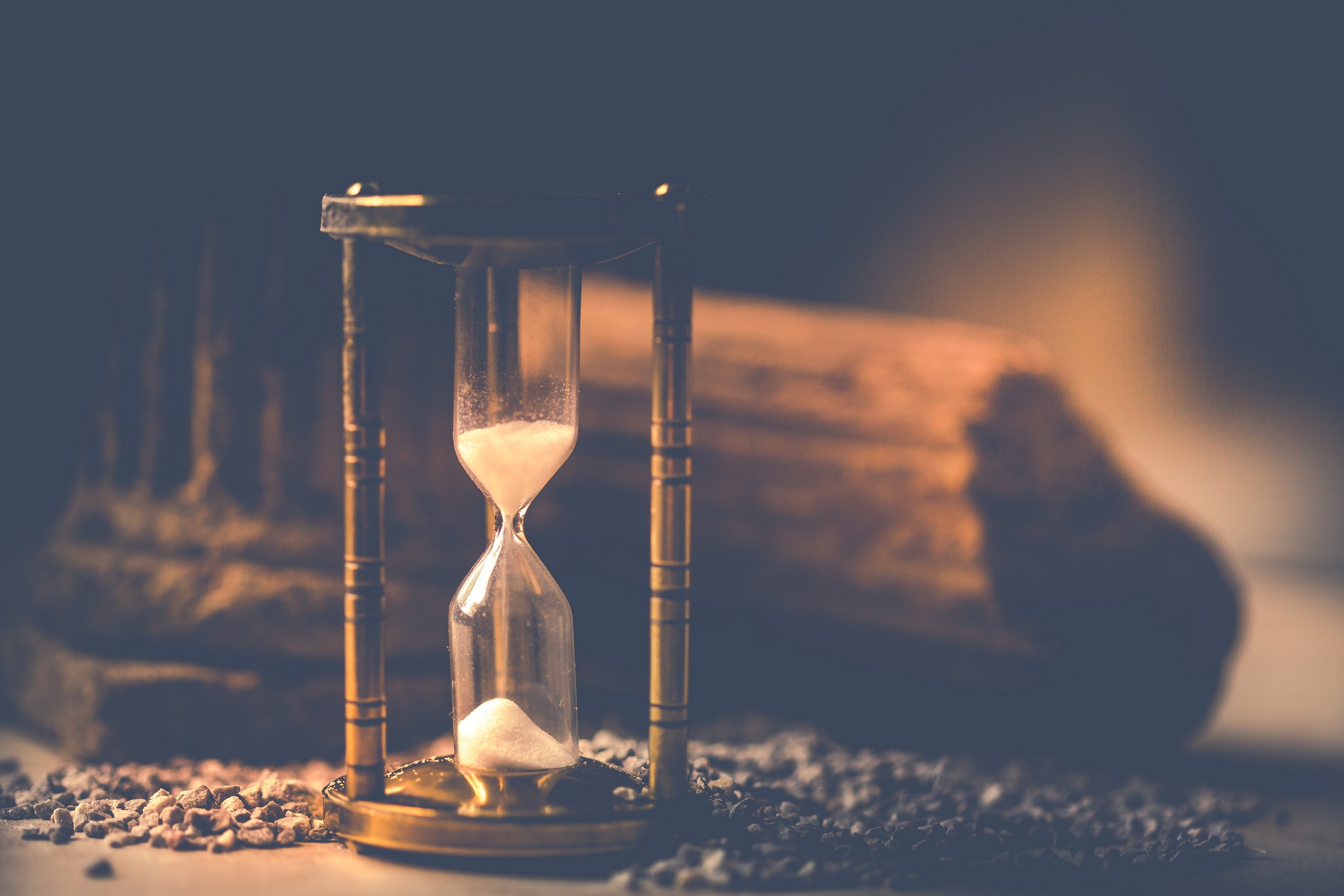 Hourglass with sand and stones HD Wallpaper