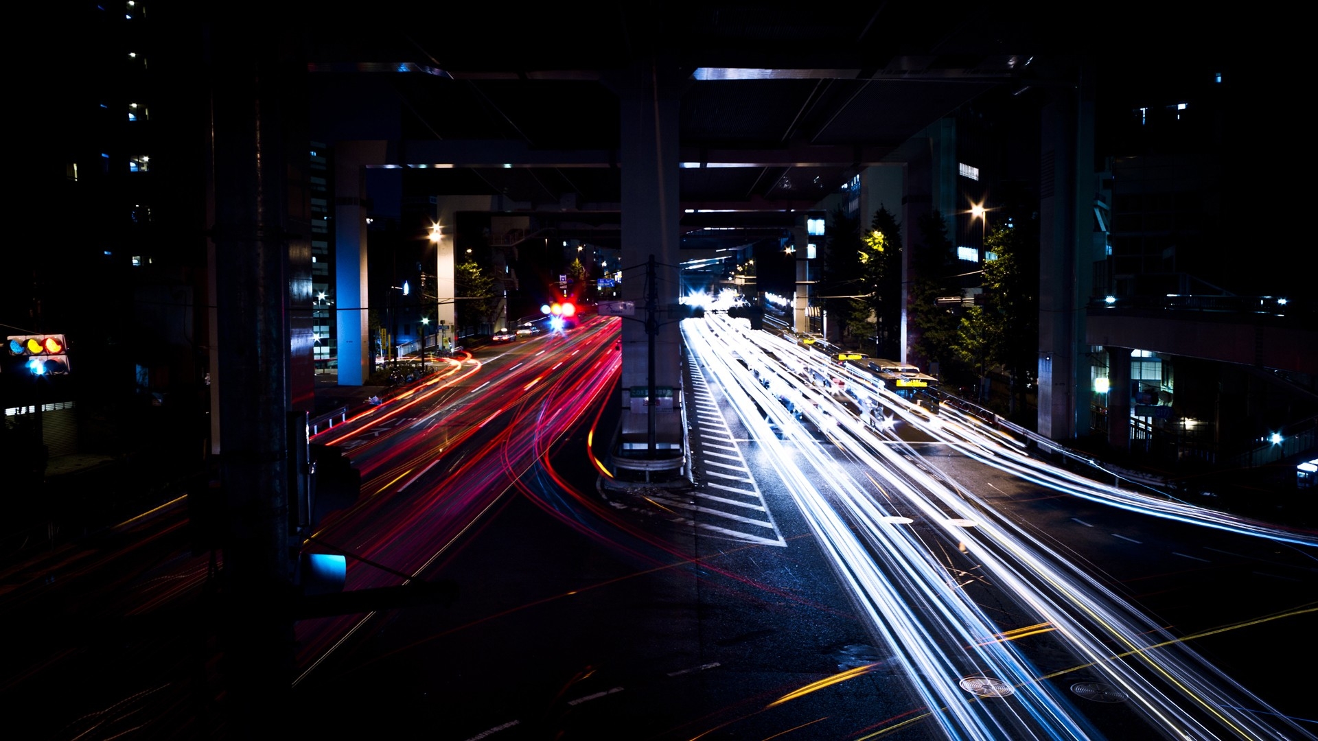 Light trails of cars on a street at night in Japan HD Wallpaper