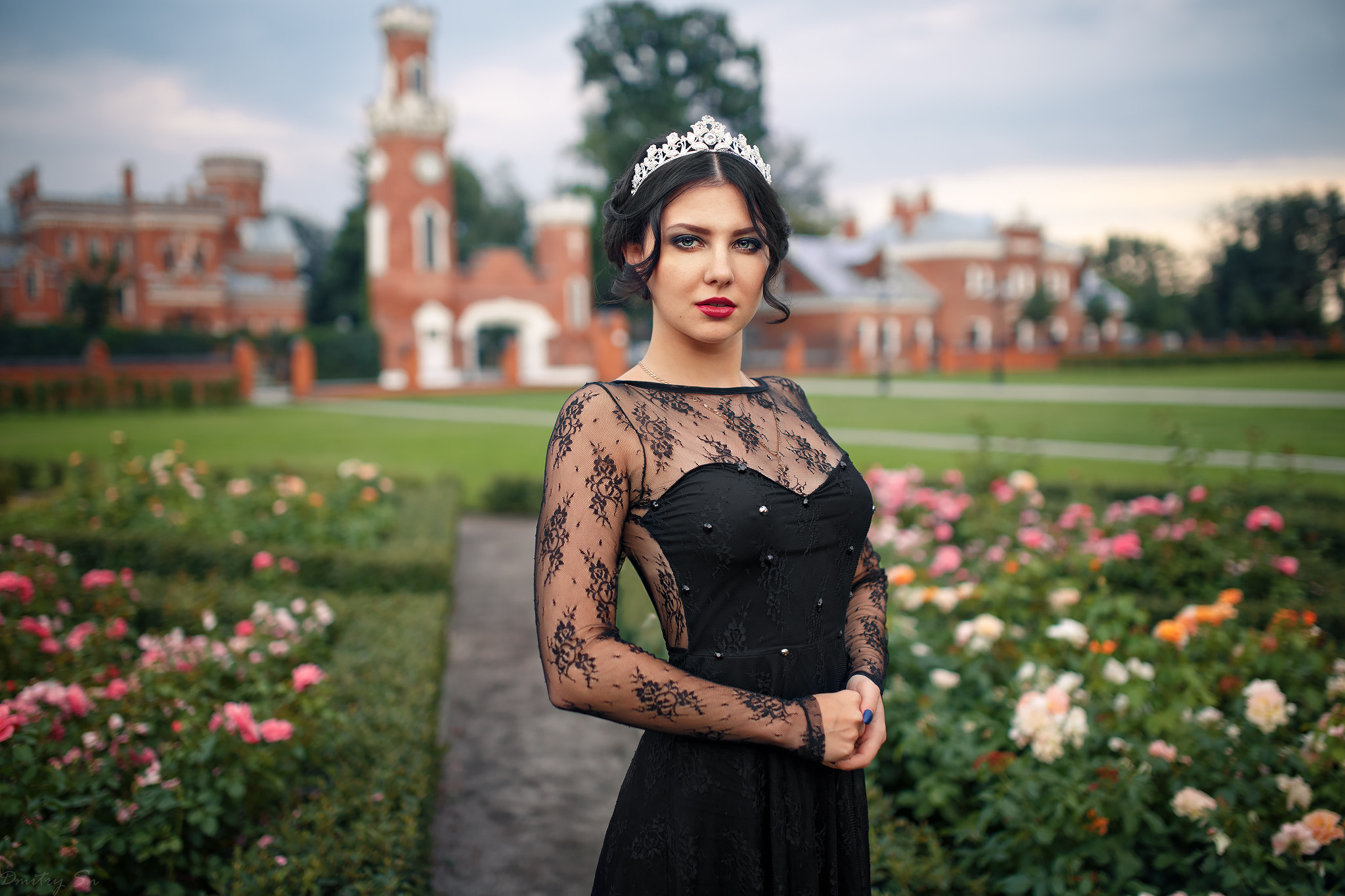 Woman in black lace dress and tiara in garden HD Wallpaper