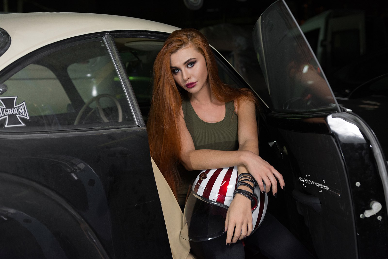 Redhead woman with helmet sitting in a vintage car HD Wallpaper