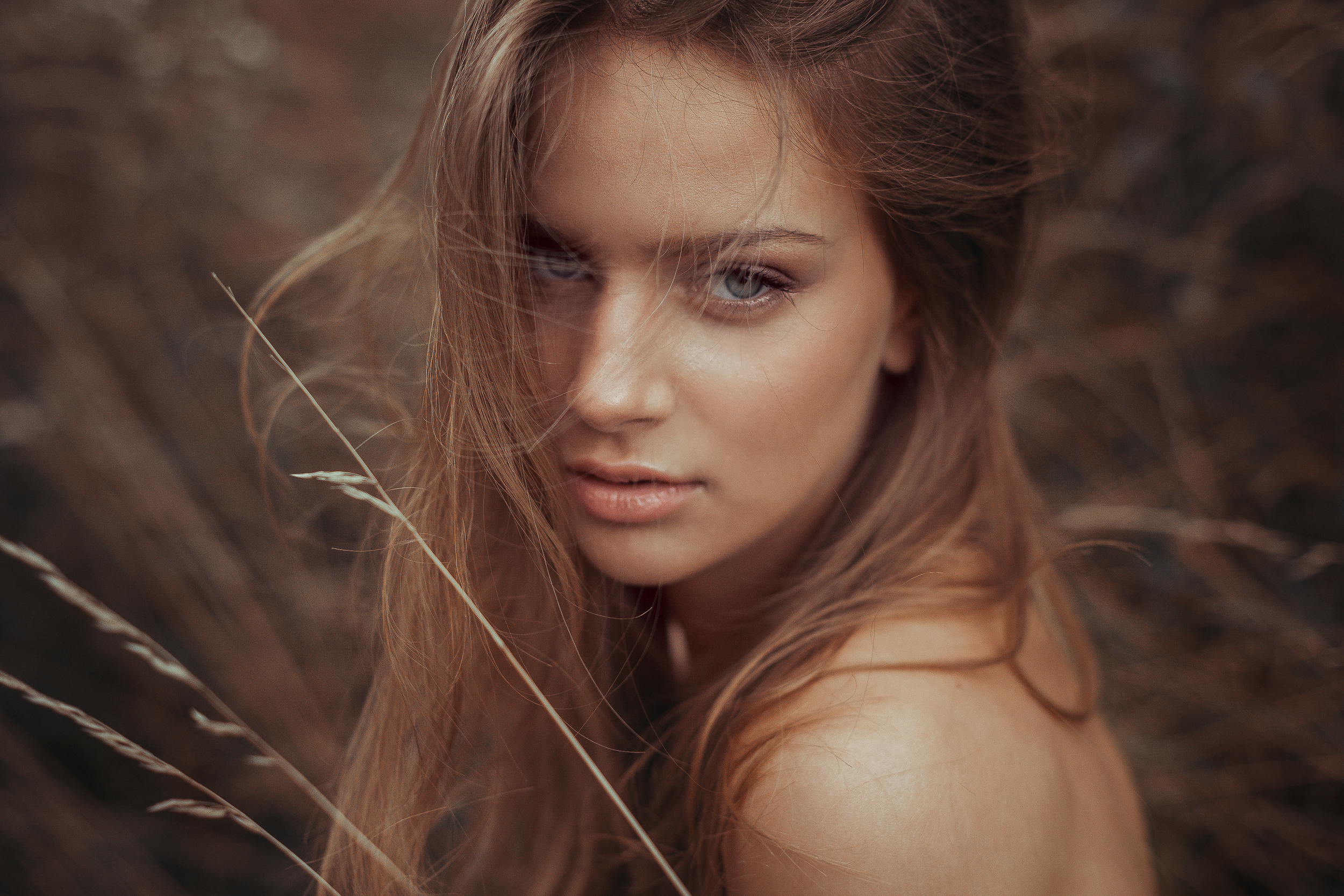 Portrait of a blonde woman with hair blowing HD Wallpaper
