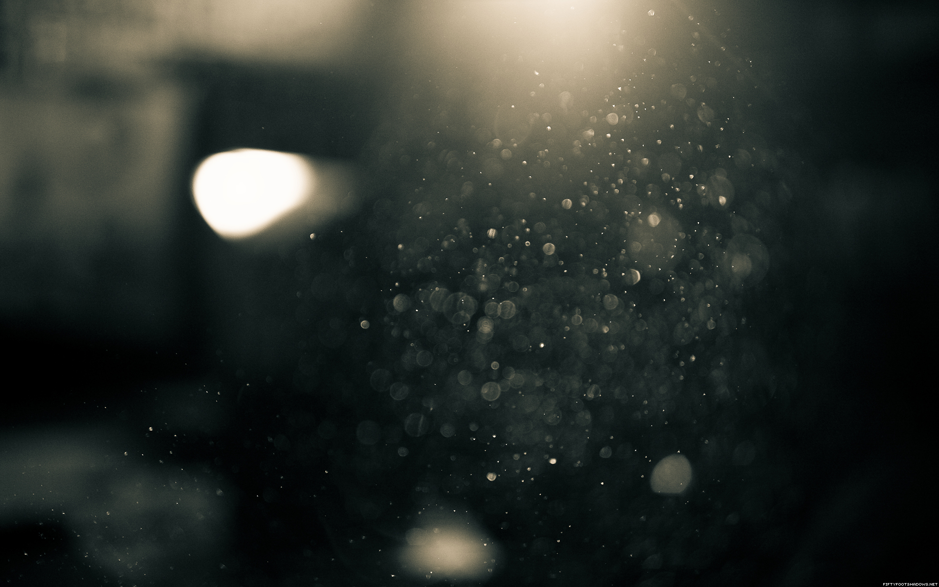 Dust particles illuminated by light HD Wallpaper