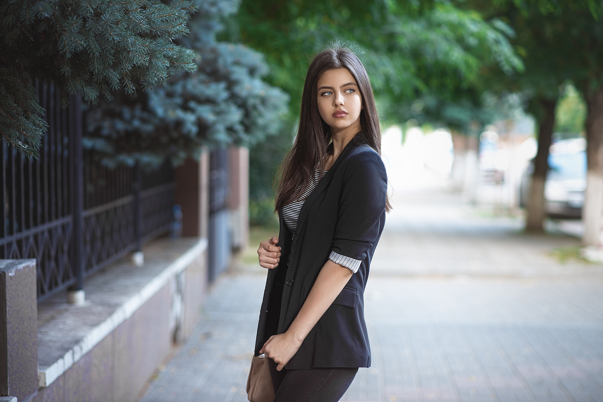 Woman in a black blazer standing outdoors HD Wallpaper
