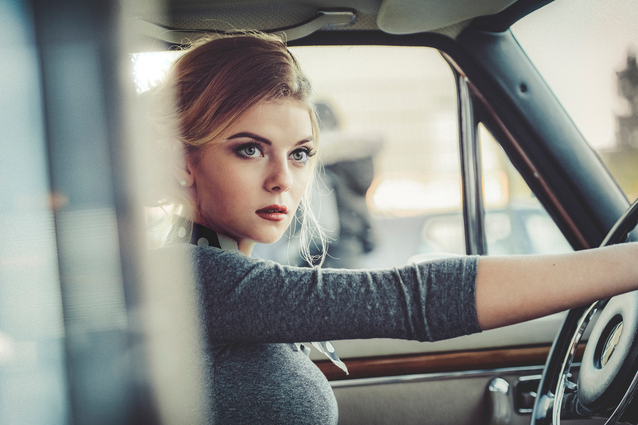 Woman driving a vintage car HD Wallpaper