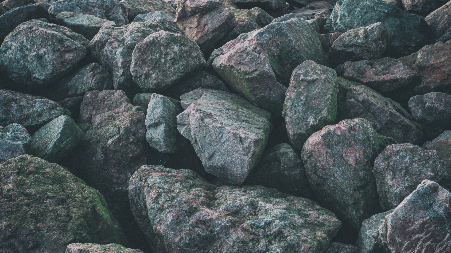 A pile of large, rough rocks HD Wallpaper