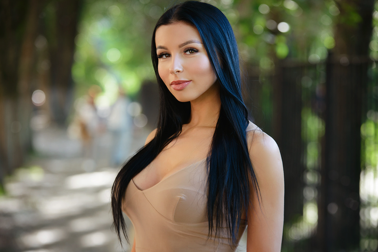 Woman with long black hair in a beige dress HD Wallpaper