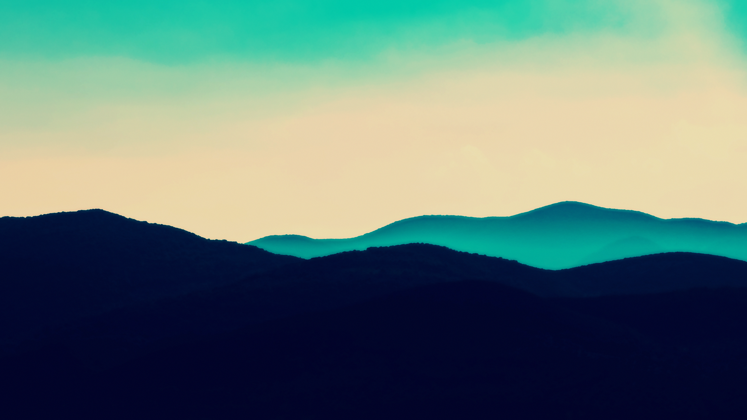 Turquoise and cream sky over dark blue mountains HD Wallpaper