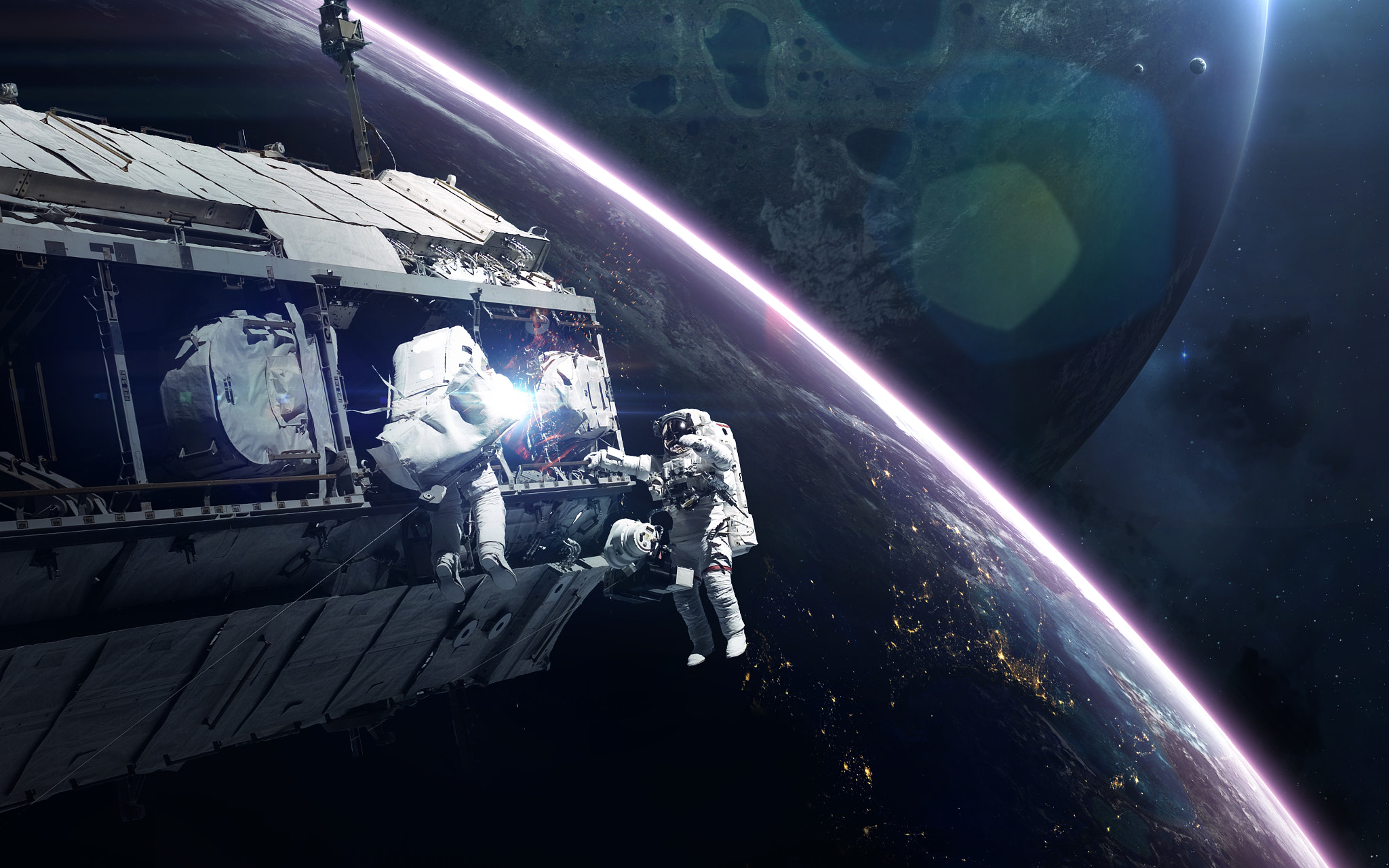 Astronauts working on a space station with Earth in the background HD Wallpaper