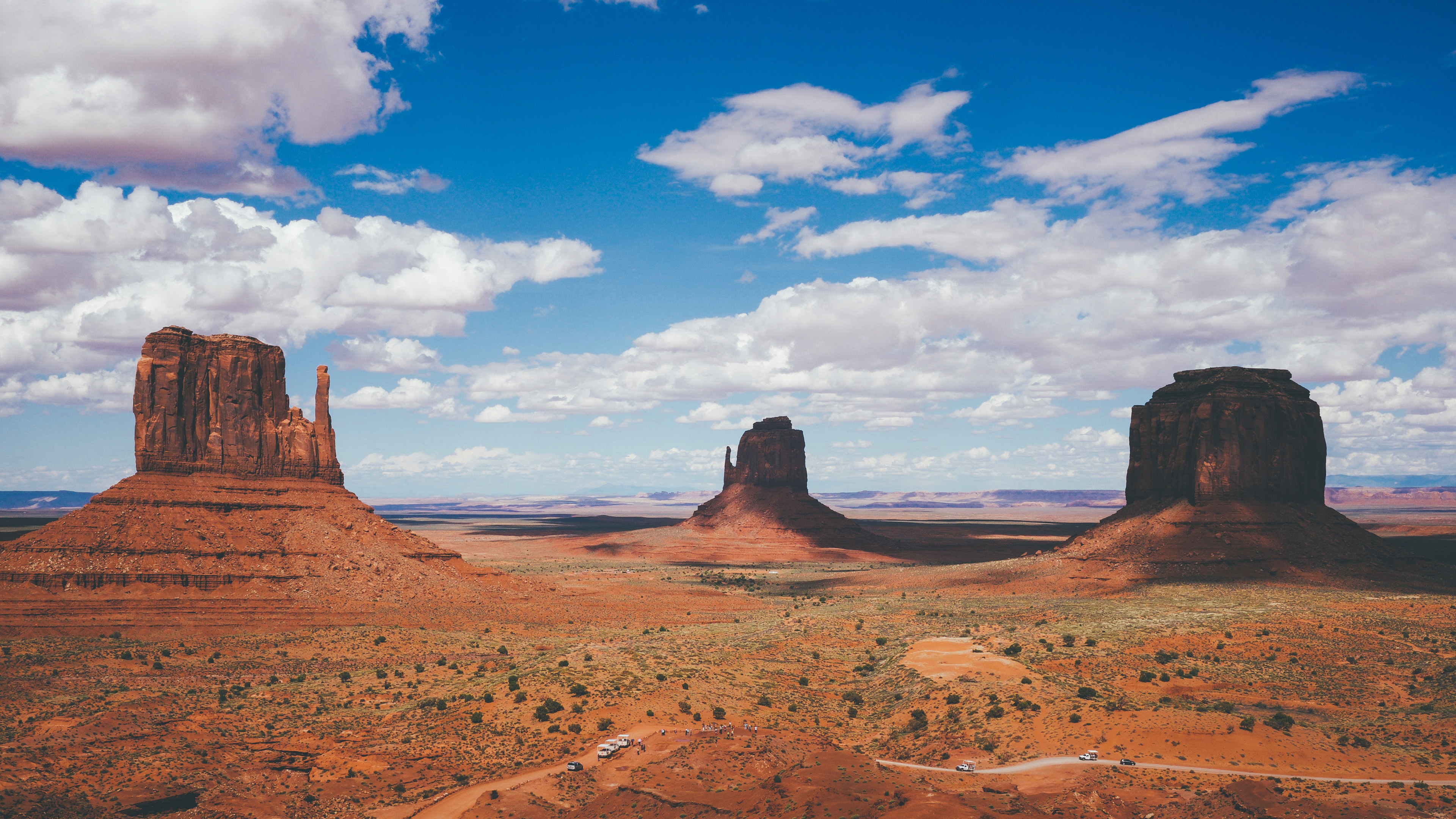 Monument Valley landscape with buttes and clouds HD Wallpaper