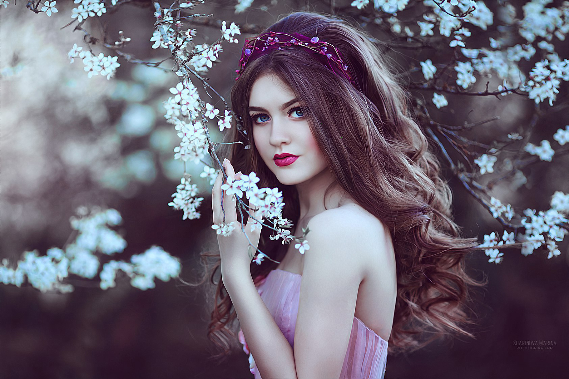 Portrait of a young woman with blue eyes and flowers HD Wallpaper