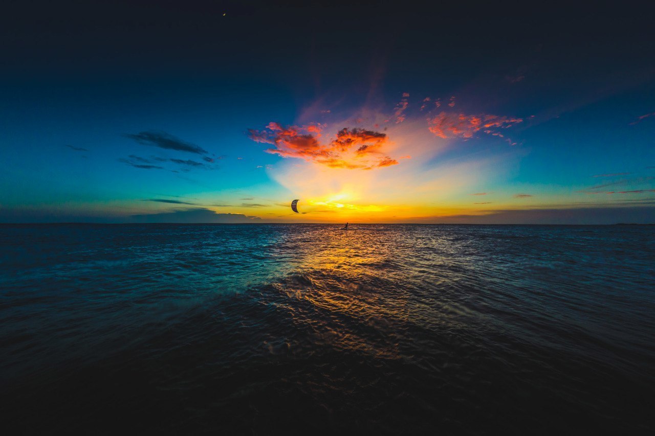Kitesurfer on the sea at sunset HD Wallpaper