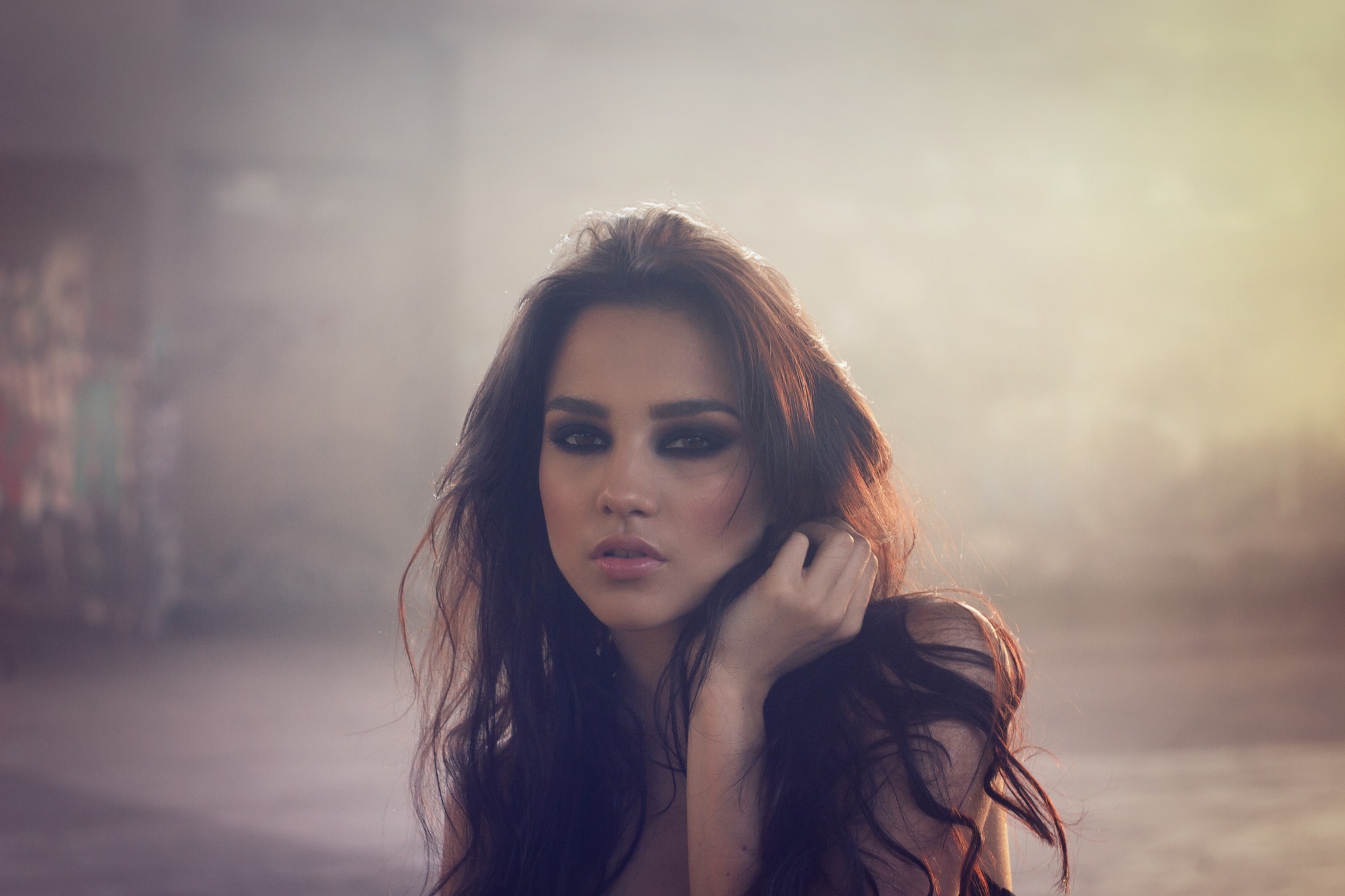 Portrait of a woman with dark eye makeup HD Wallpaper