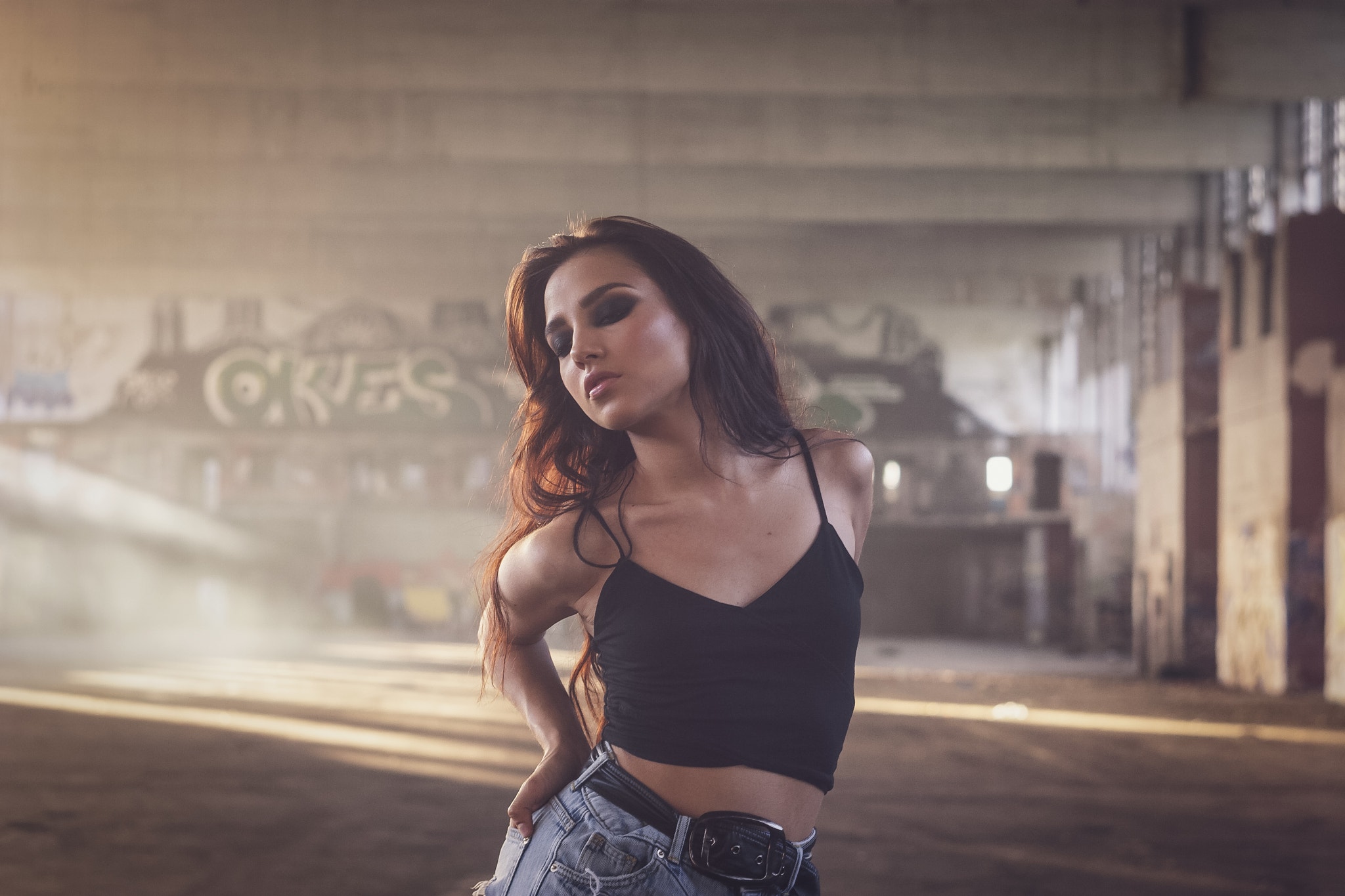 Woman in crop top and jean shorts in abandoned building HD Wallpaper