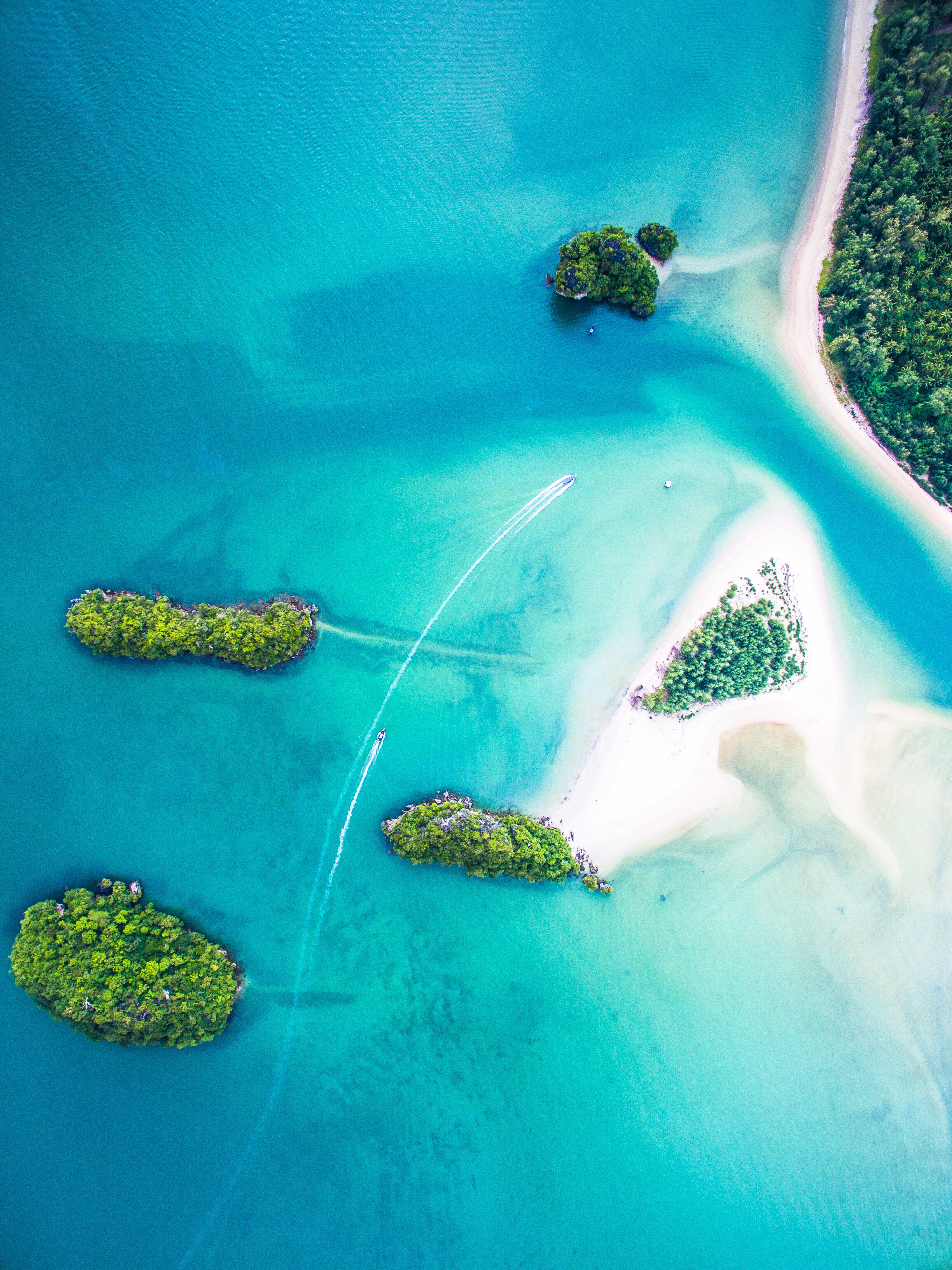 Aerial view of tropical islands and boats in turquoise water HD Wallpaper