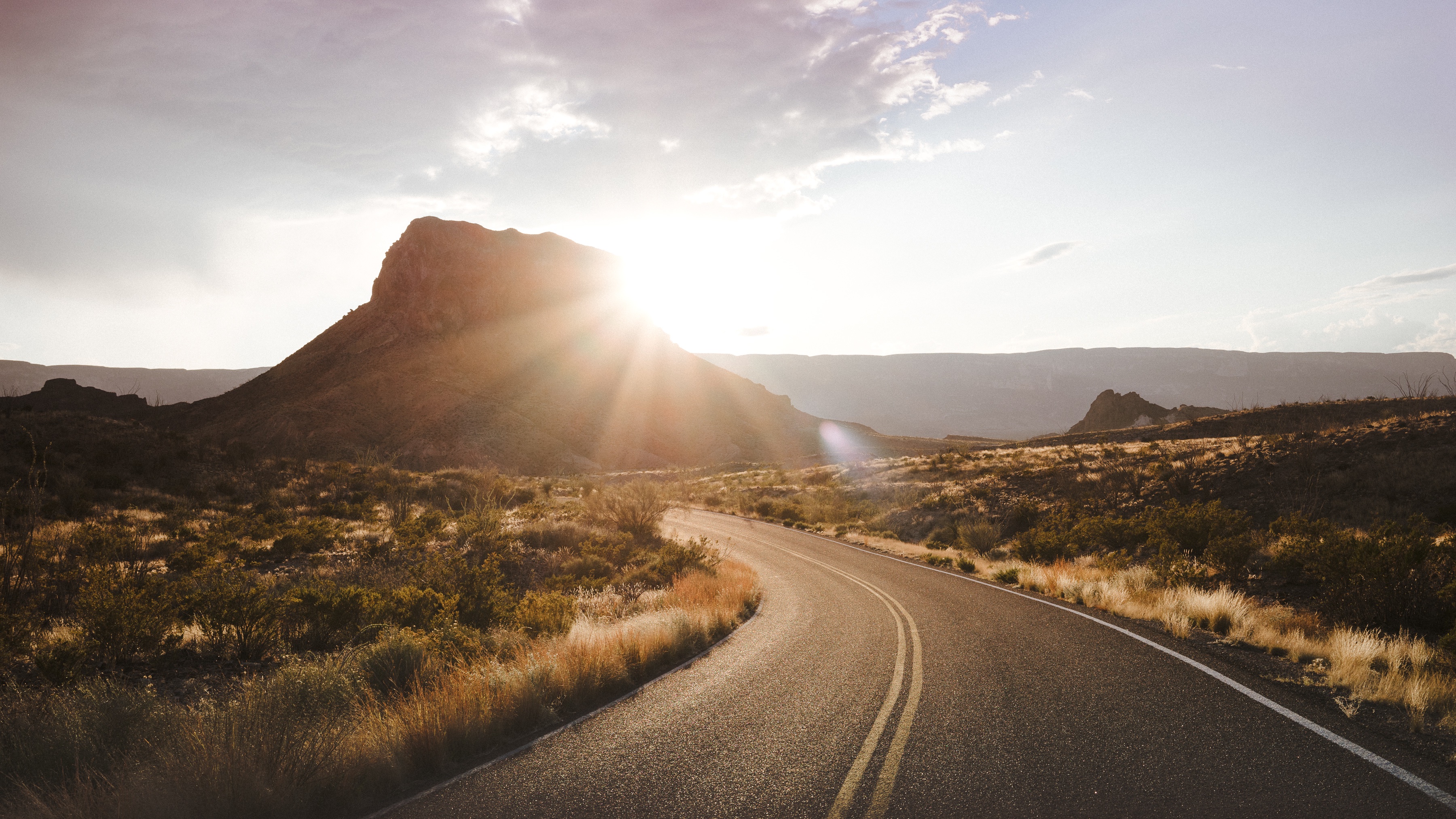 Desert road with mountain and sunlight HD Wallpaper