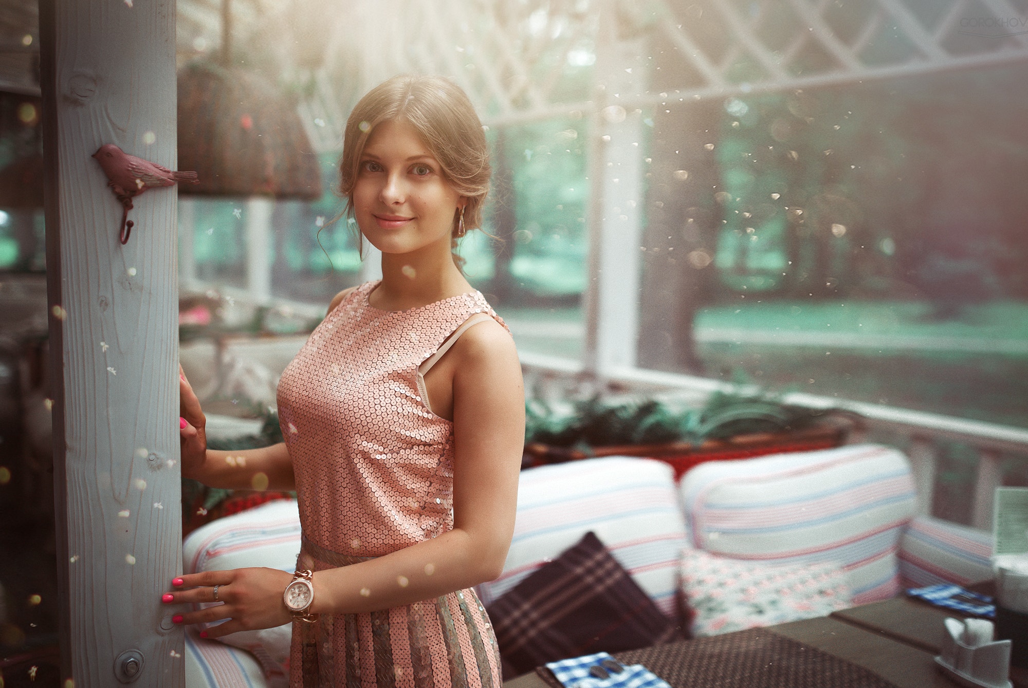 Woman in sequined dress standing near a wooden post HD Wallpaper