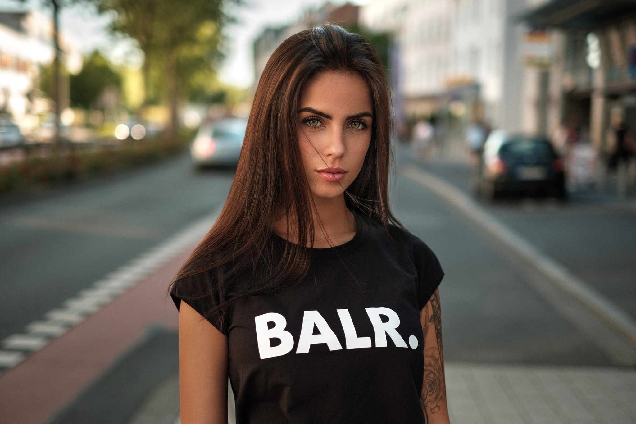 Woman with tattoo wearing BALR. t-shirt outdoors HD Wallpaper