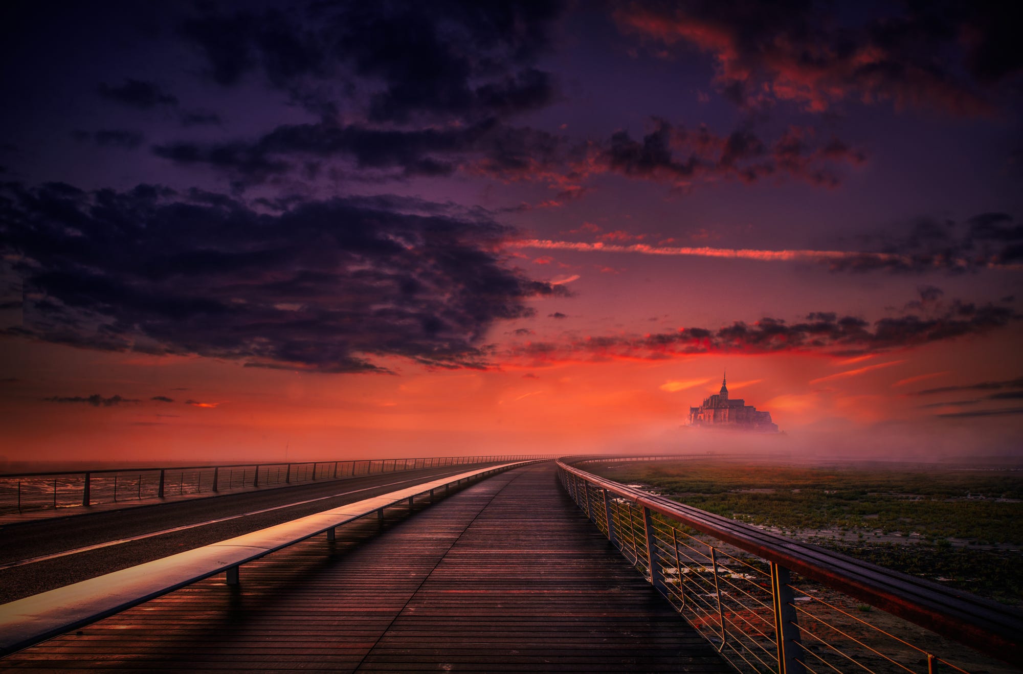 Wooden walkway leading to a castle in mist at sunset HD Wallpaper
