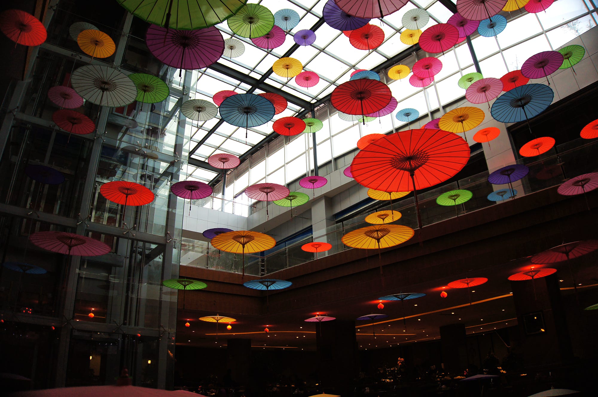 Colorful Japanese umbrellas hanging from a ceiling HD Wallpaper