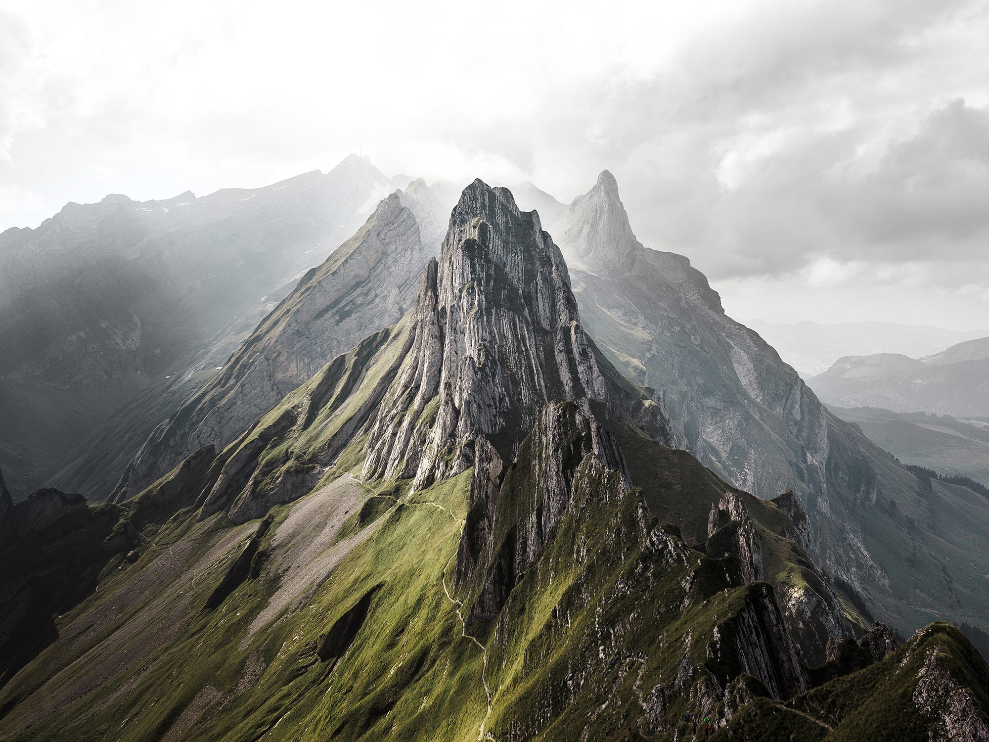 Sharp mountain peaks in Switzerland under cloudy sky HD Wallpaper