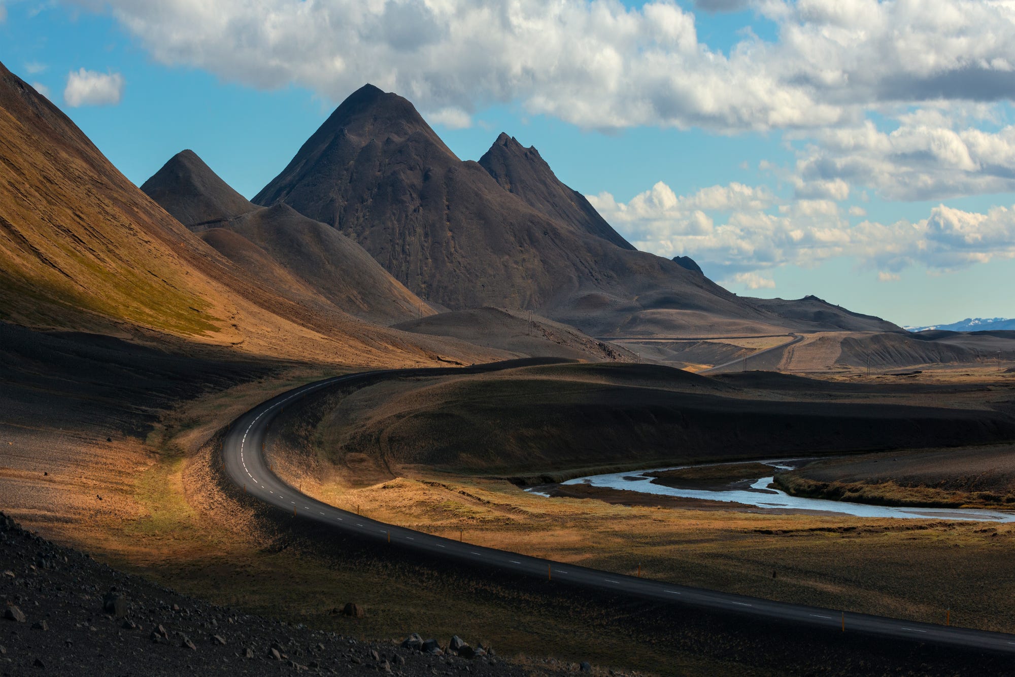 Winding road through mountains in Iceland HD Wallpaper