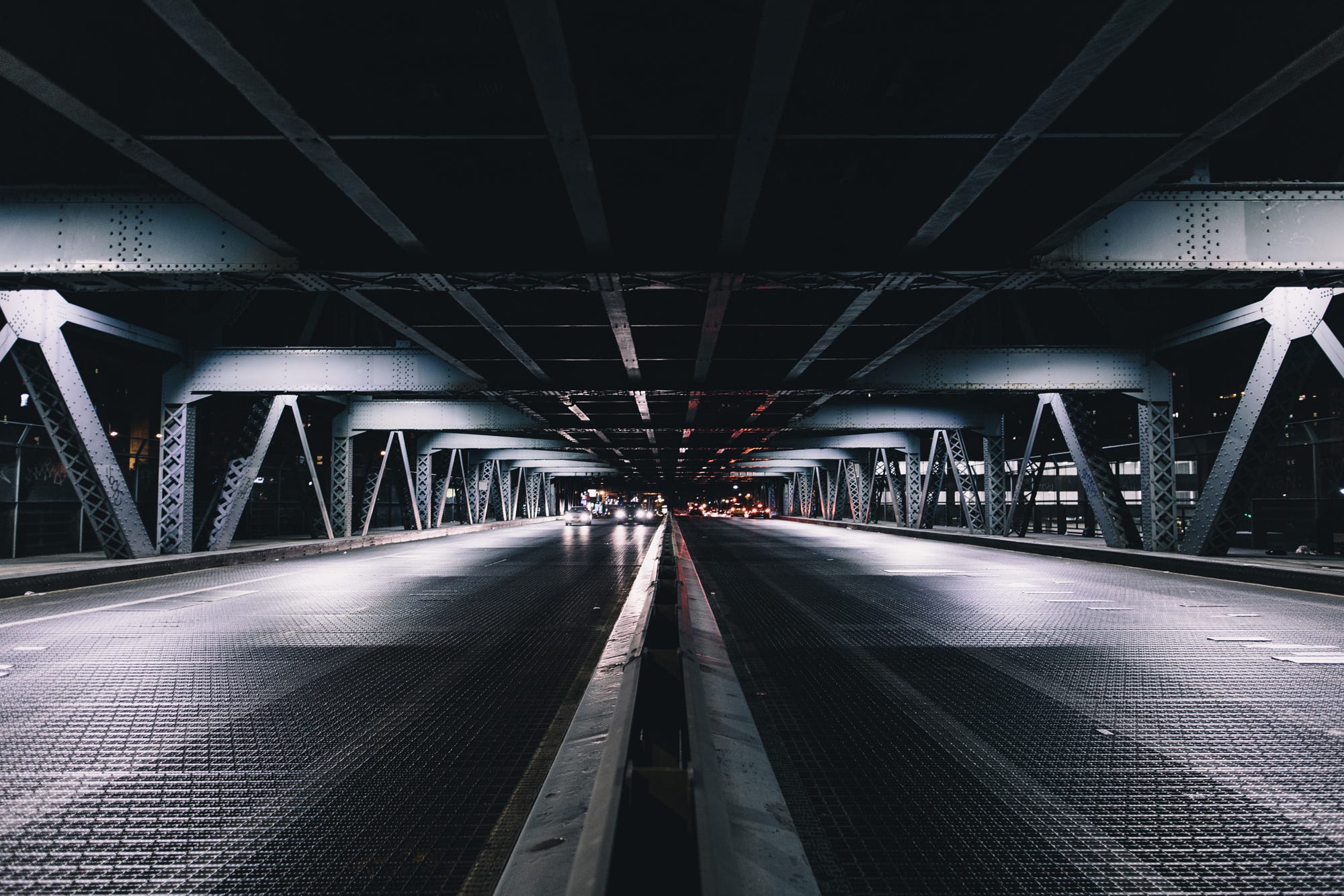 Underneath a bridge in New York City at night HD Wallpaper