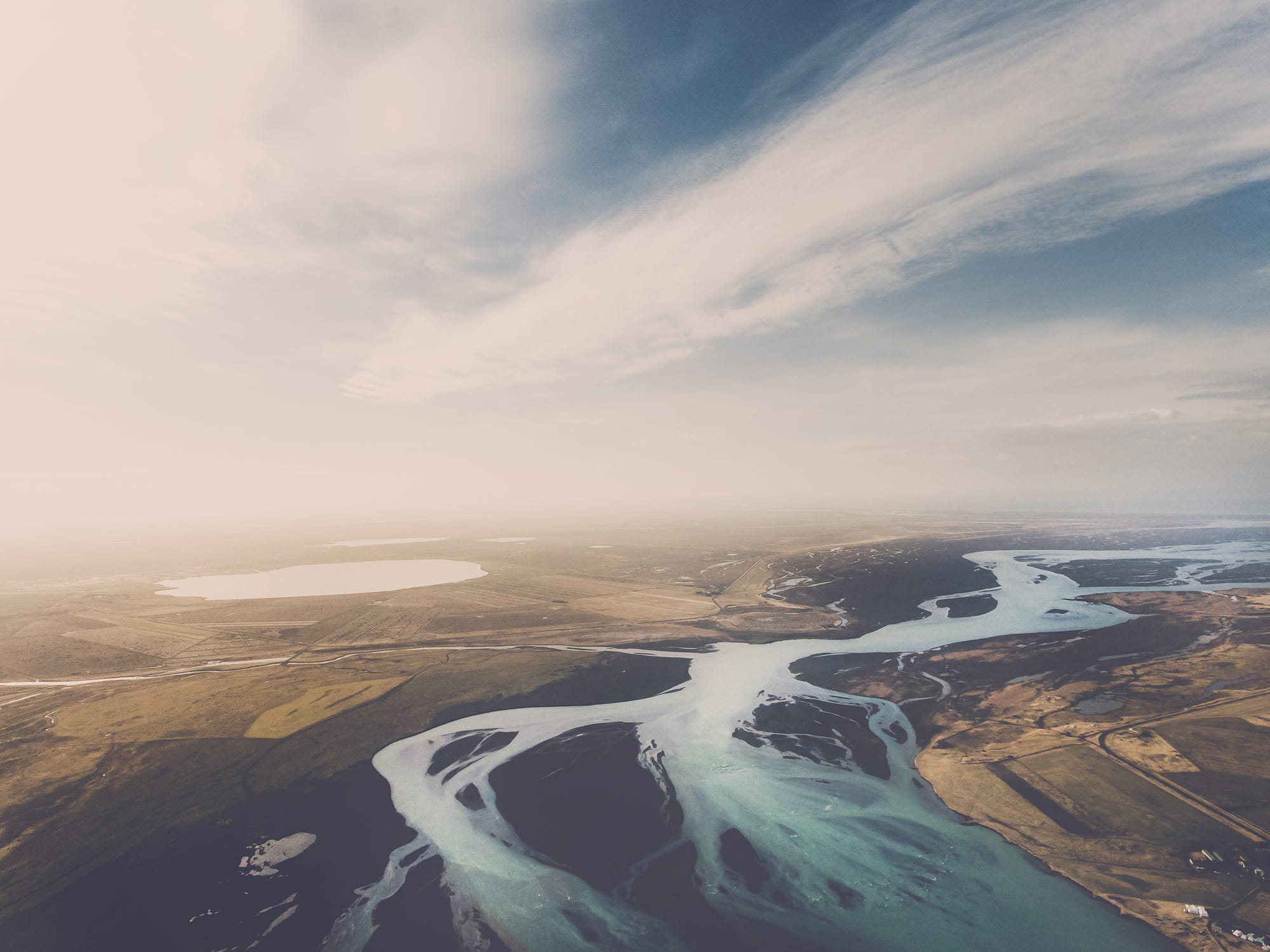 Aerial view of a braided river landscape HD Wallpaper