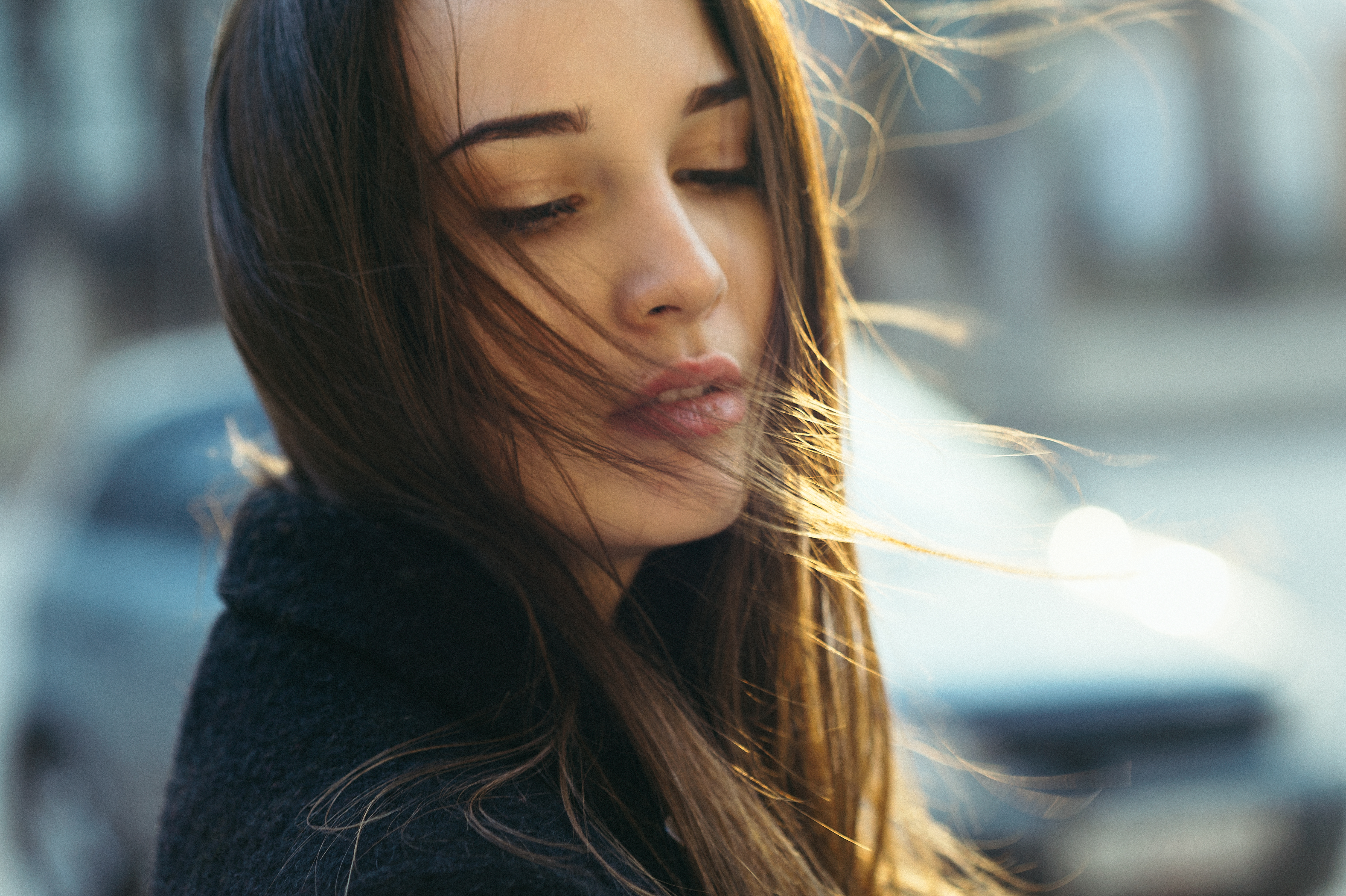 Woman with brown hair in the wind HD Wallpaper
