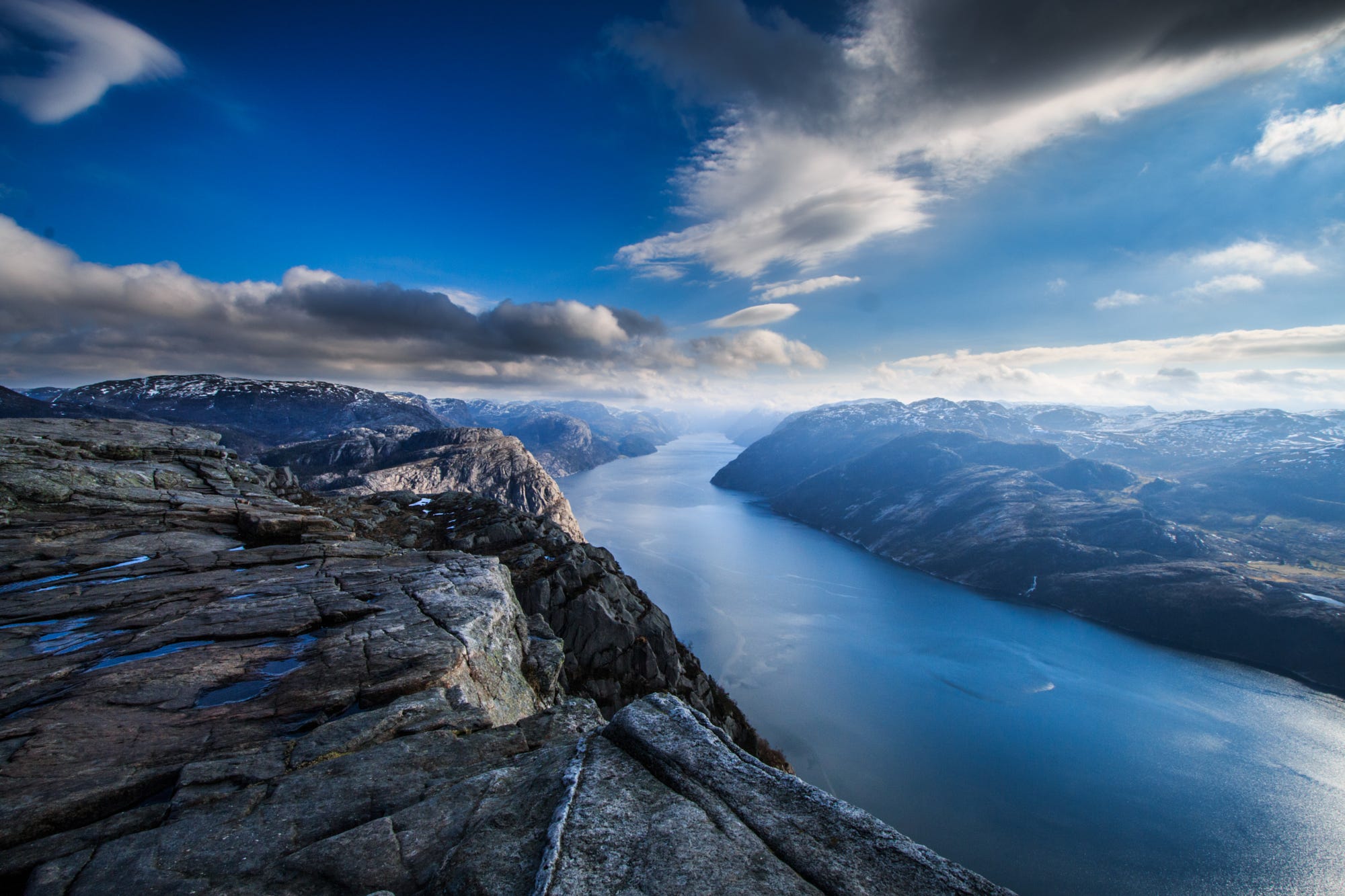 Majestic fjord landscape with mountains and clouds HD Wallpaper