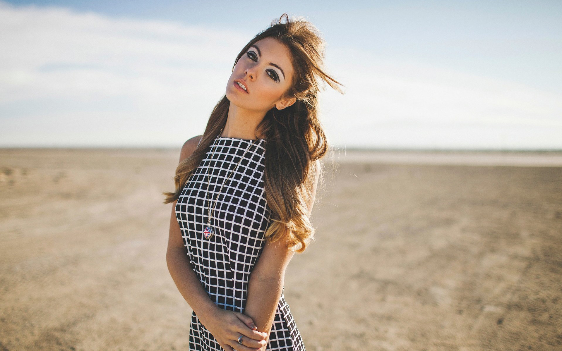 Carmella Rose in a checkered dress on a beach HD Wallpaper