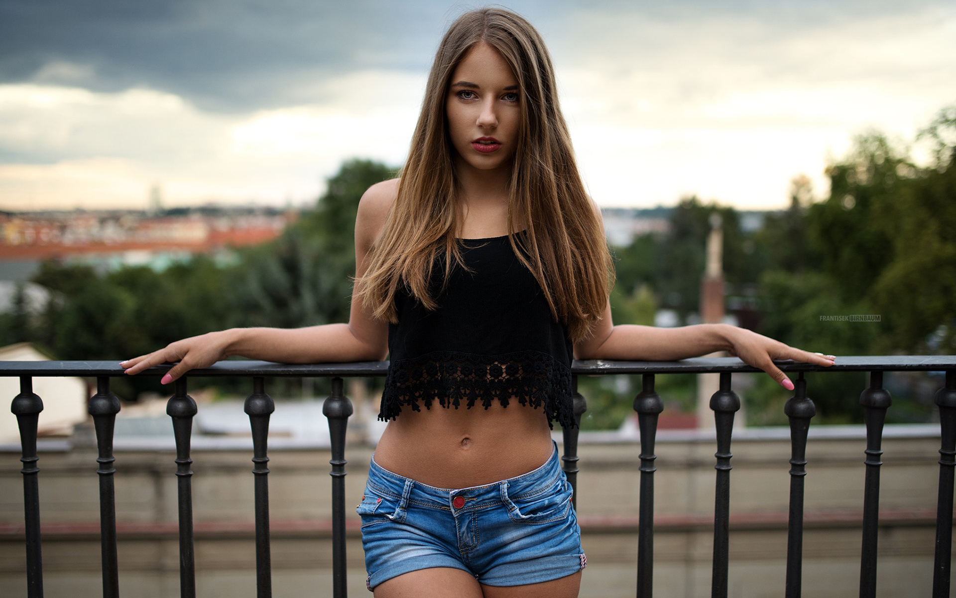 Woman in black crop top and denim shorts on balcony HD Wallpaper