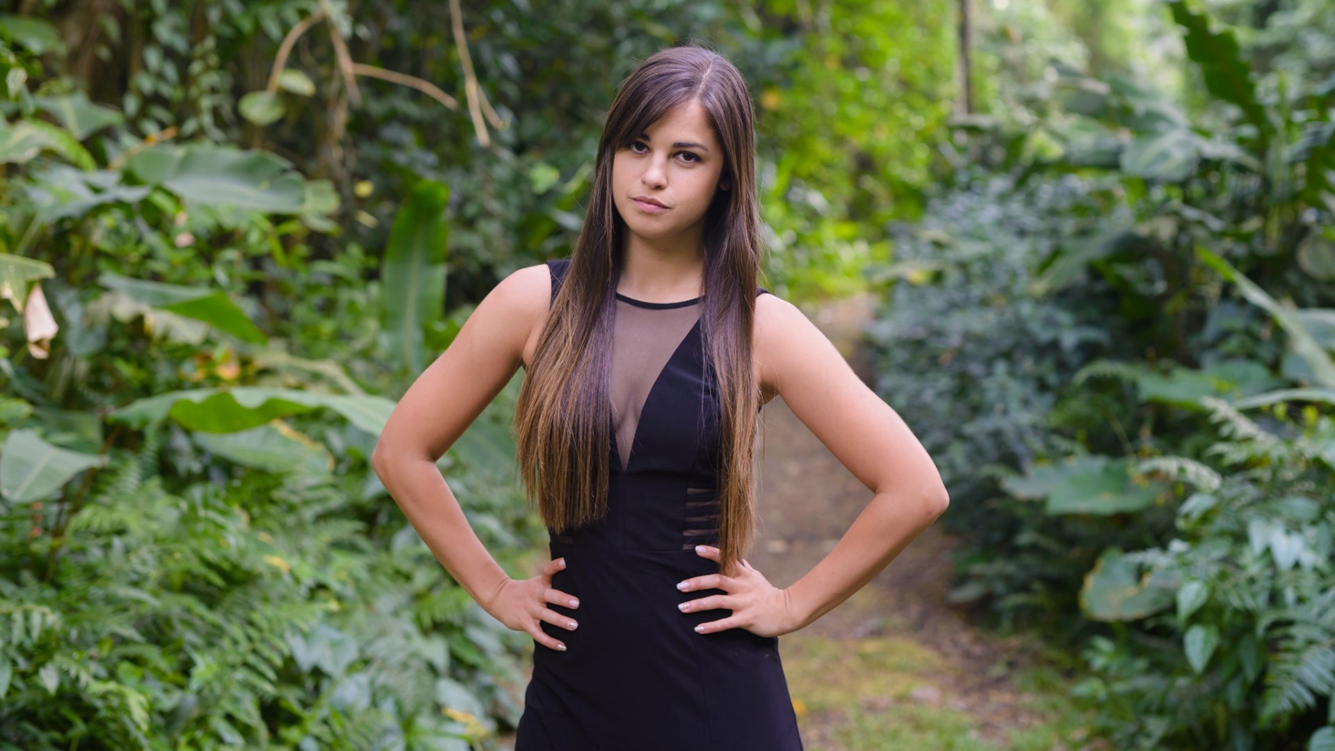 Woman in black dress in a forest HD Wallpaper