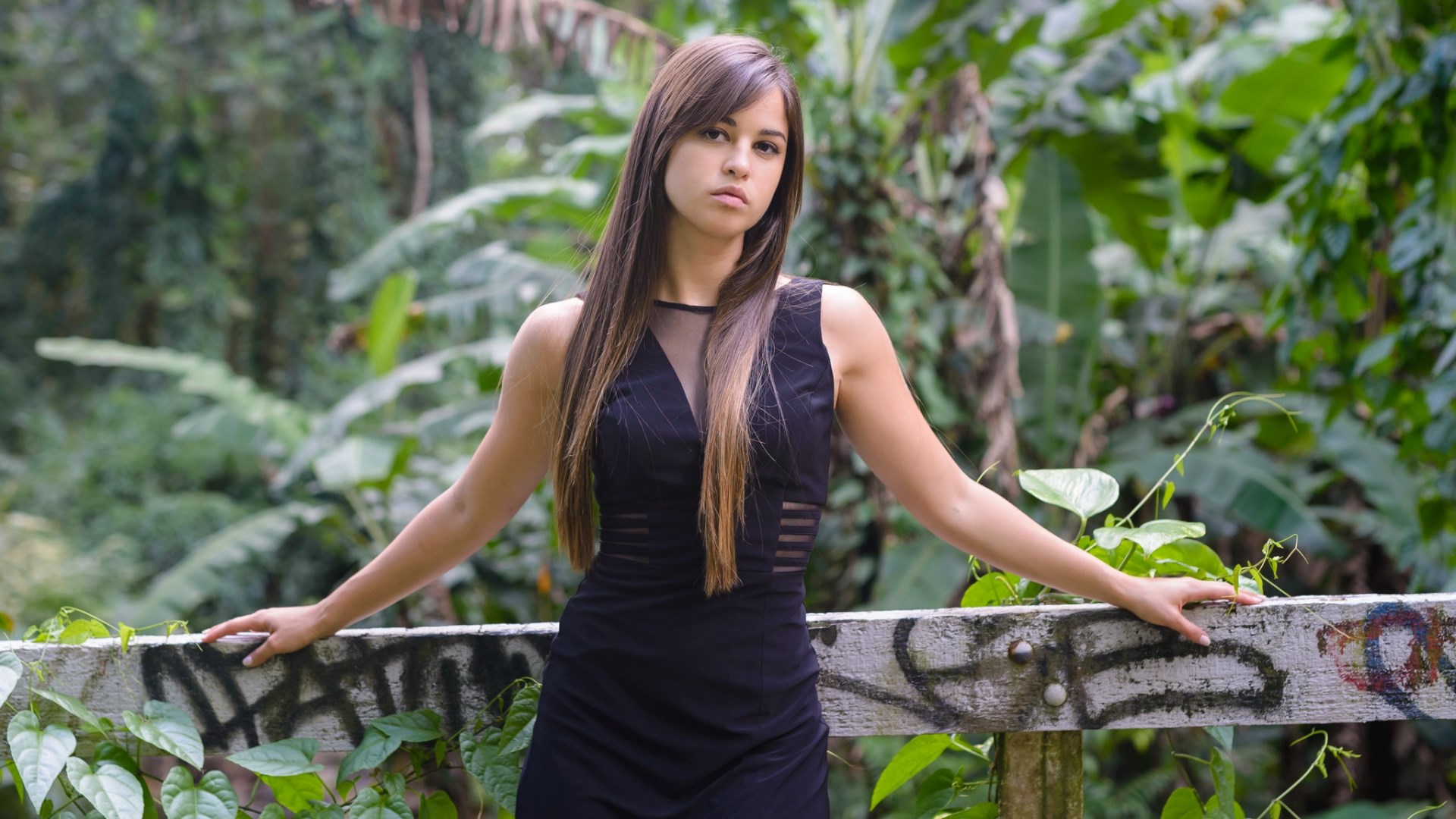 Woman in black dress posing outdoors HD Wallpaper