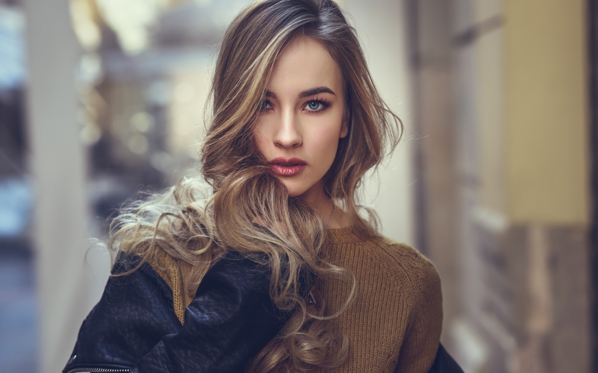 Woman with blonde hair and blue eyes wearing a leather jacket HD Wallpaper