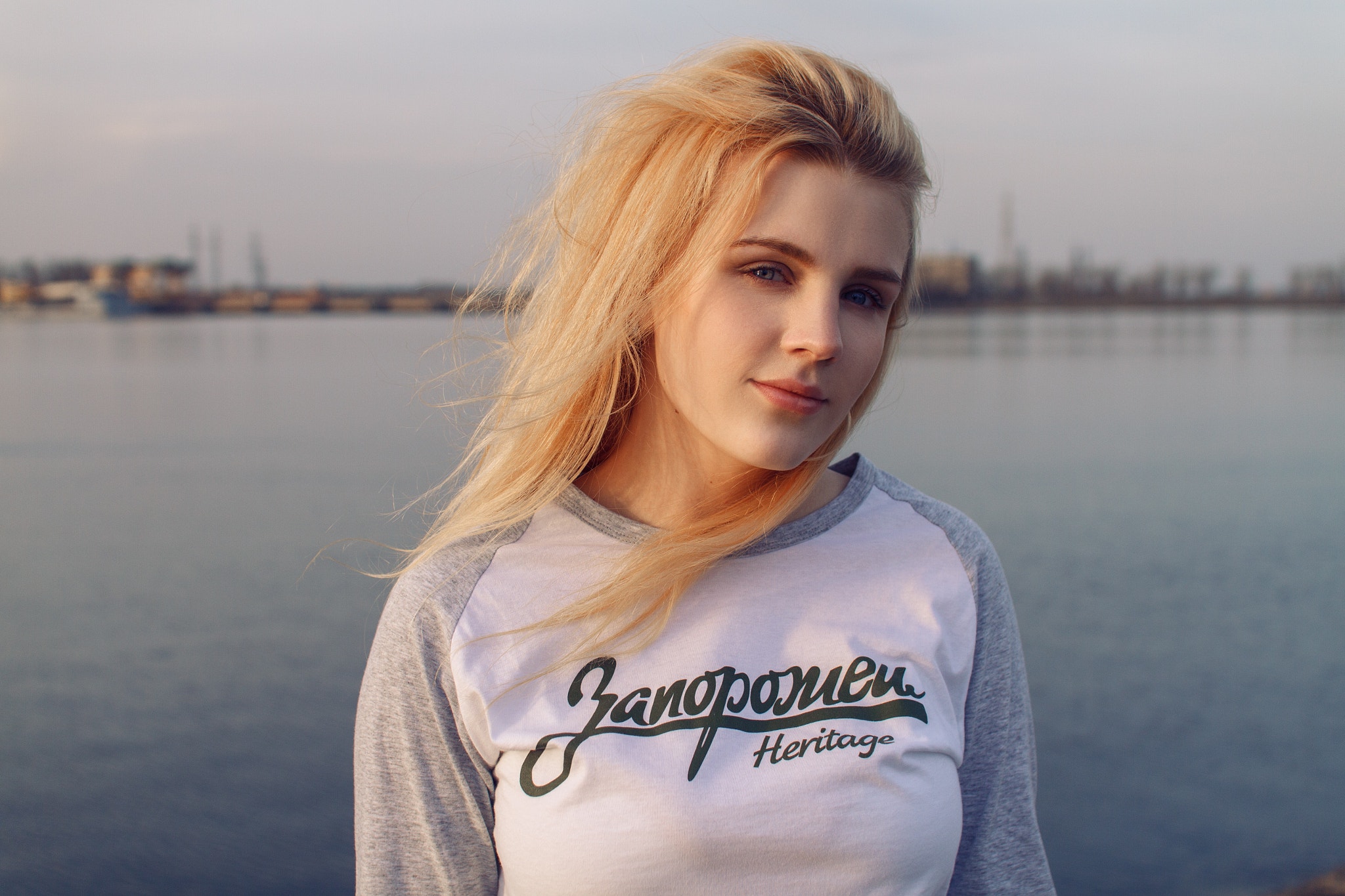 Woman with blonde hair by the water HD Wallpaper
