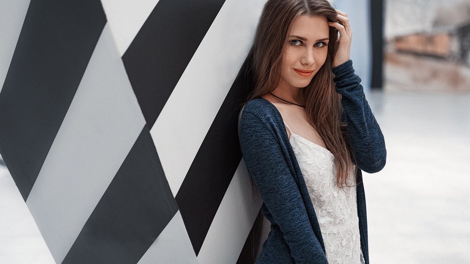 Woman with long brown hair wearing a white top and blue cardigan HD Wallpaper