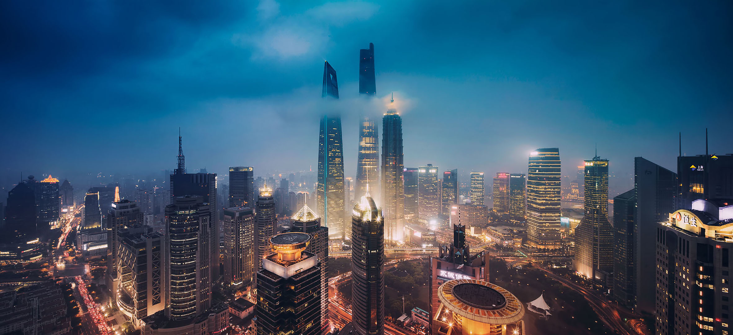 Shanghai cityscape at night with skyscrapers and clouds HD Wallpaper