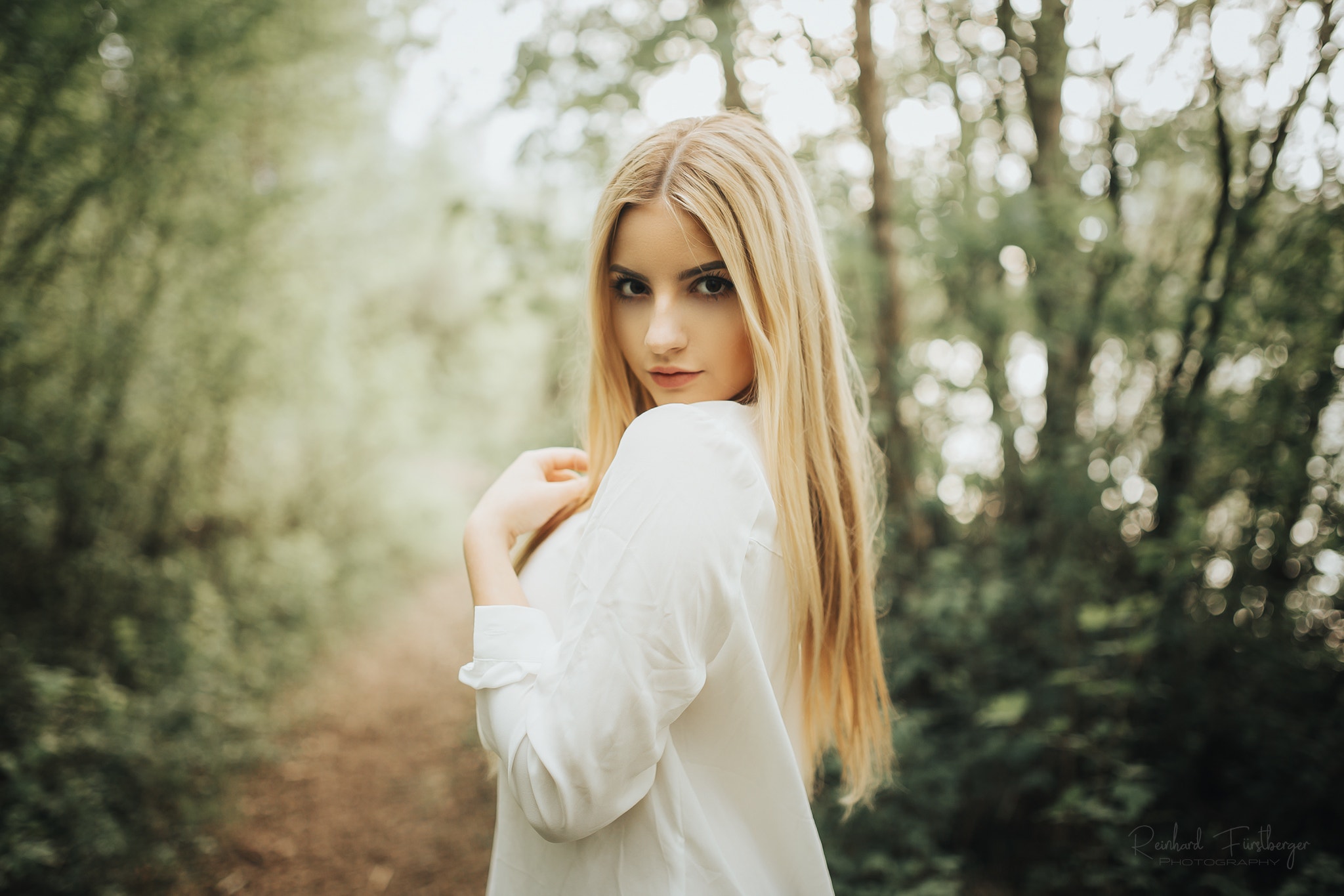Woman with blonde hair in a white shirt outdoors HD Wallpaper