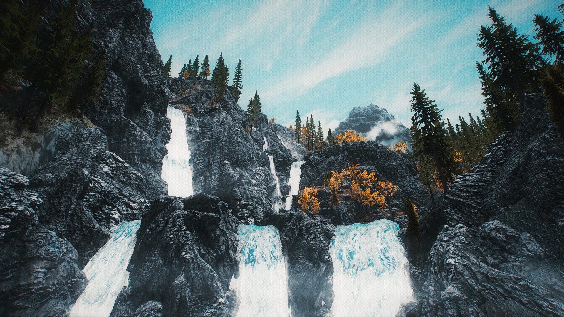 Waterfalls cascading down rocky cliffs in Skyrim HD Wallpaper